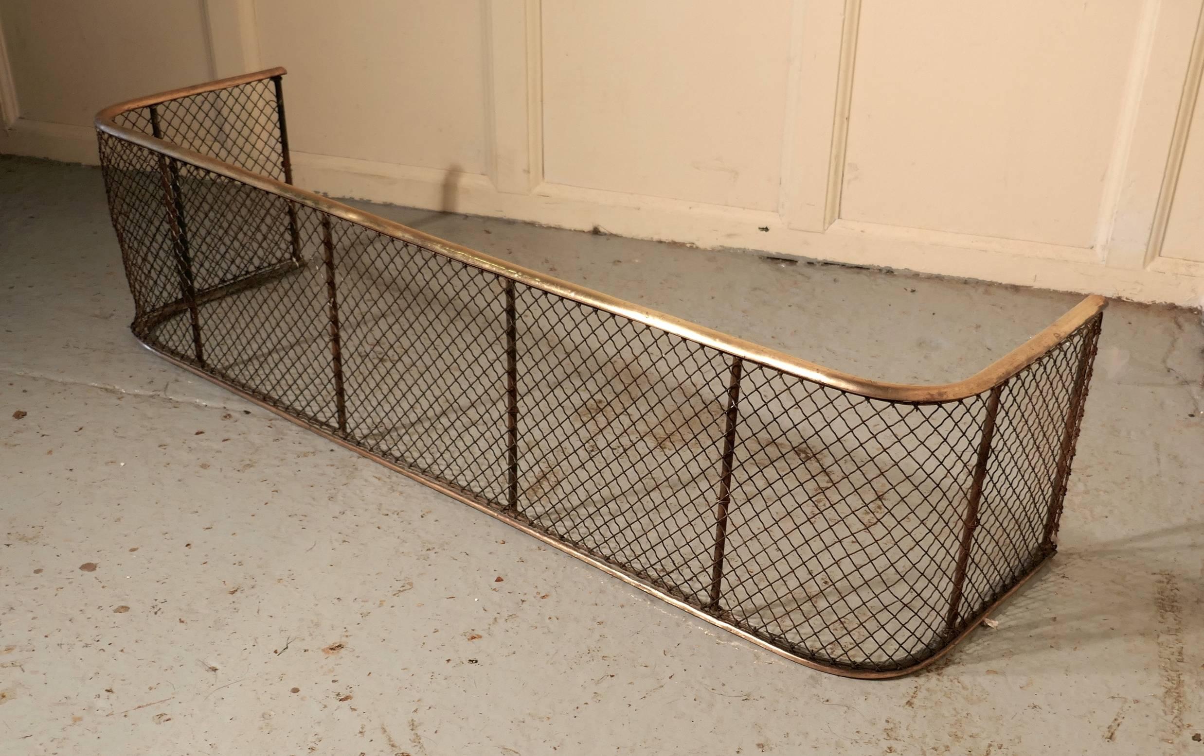Victorian nursery fire guard or club fender

This is a Victorian antique club fender often known as a nursery guard as it completely surrounds the fire
The fire guard has a slightly curved brass top rail and a brass bottom rail, the fender is in