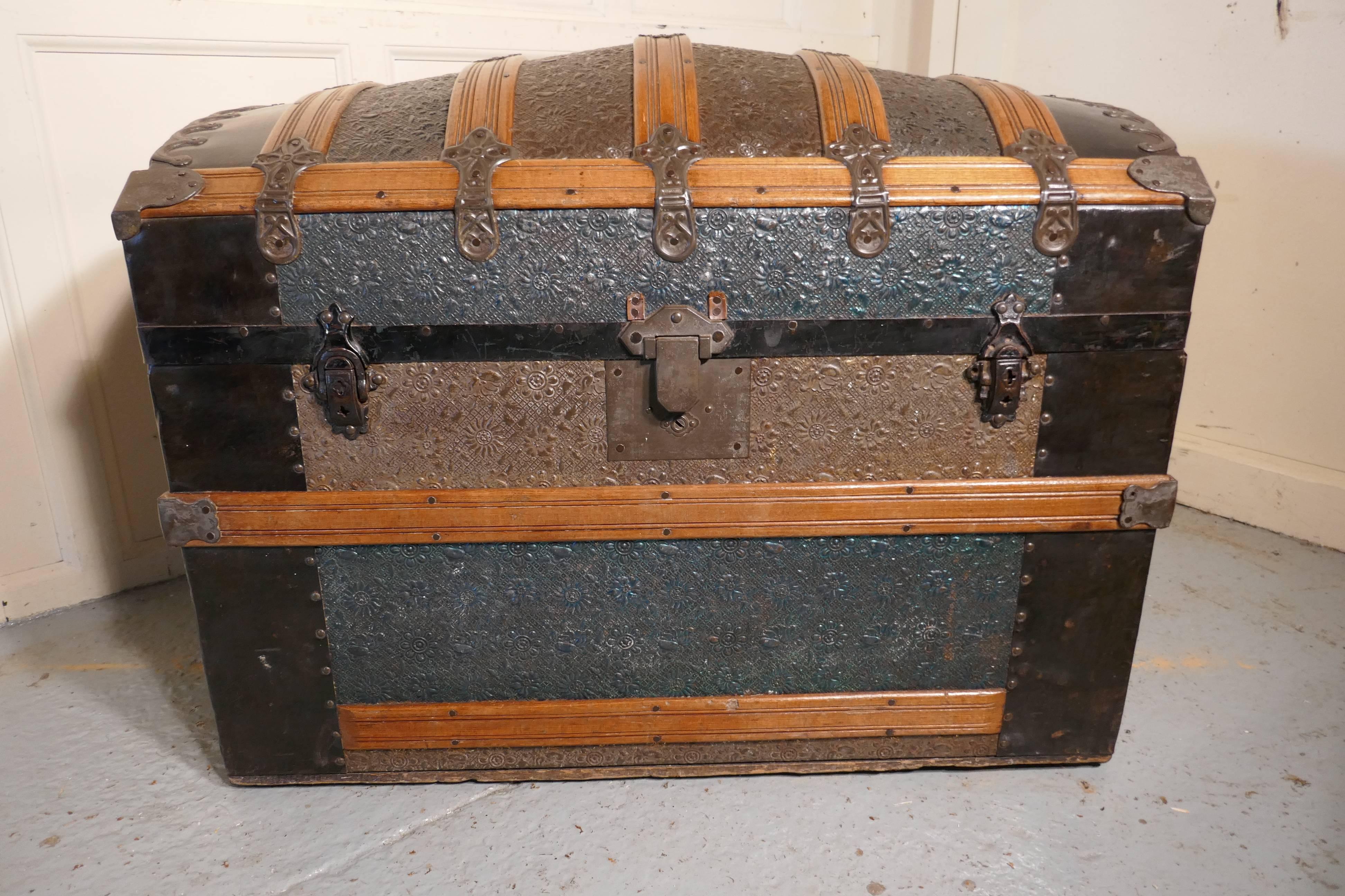 Very decorative Spanish dome top trunk

The trunk has a pine carcass, and it is covered in very decorative embossed painted metal, it has wooden banding with decorative metal work around all the edges. Some of the metal work has been simulated to