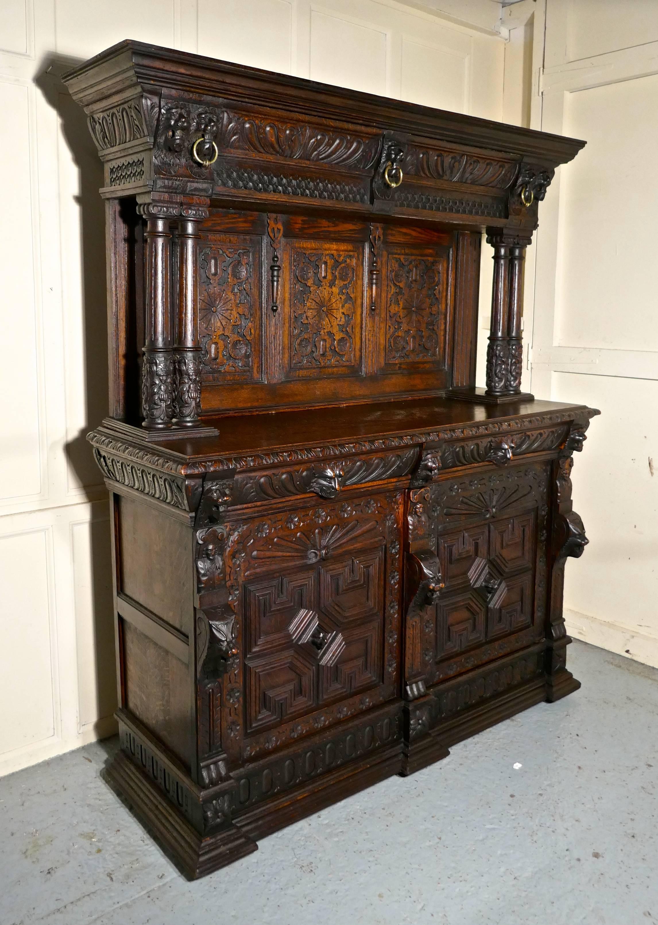 18th century carved oak buffet sideboard dresser


This is a handsome piece with a wonderful patina, the carving is of very fine quality, the gargoyles at the top depict wild cats or the Green Man 
The dresser has a tall carved panelled back