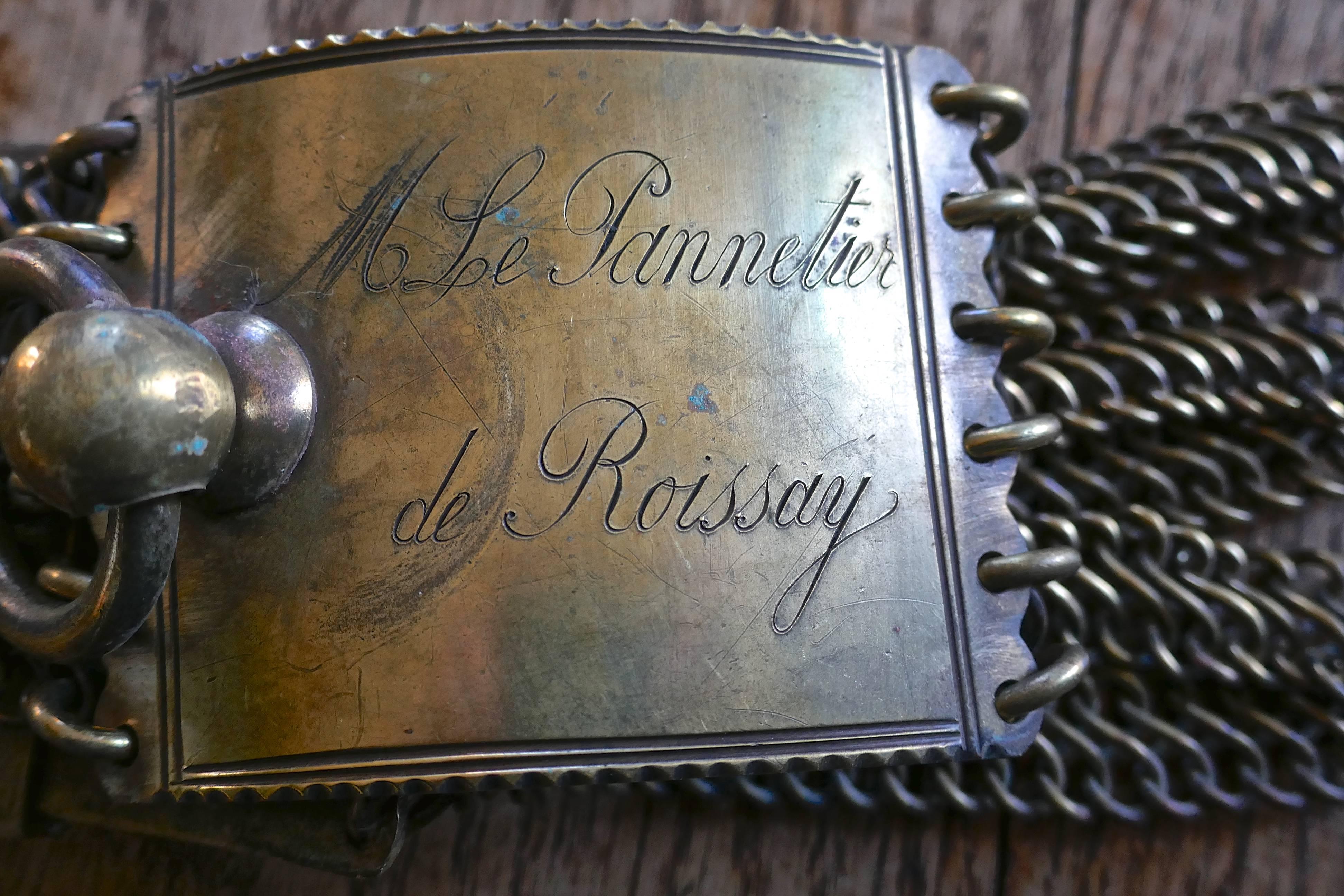 18th century, French bronze hunting dog collar and comb

A late 18th century, French bronze hunting dog collar, the collar is Engraved giving the piece the necessary provenance to trace the history of the Chateau and the family from which it has
