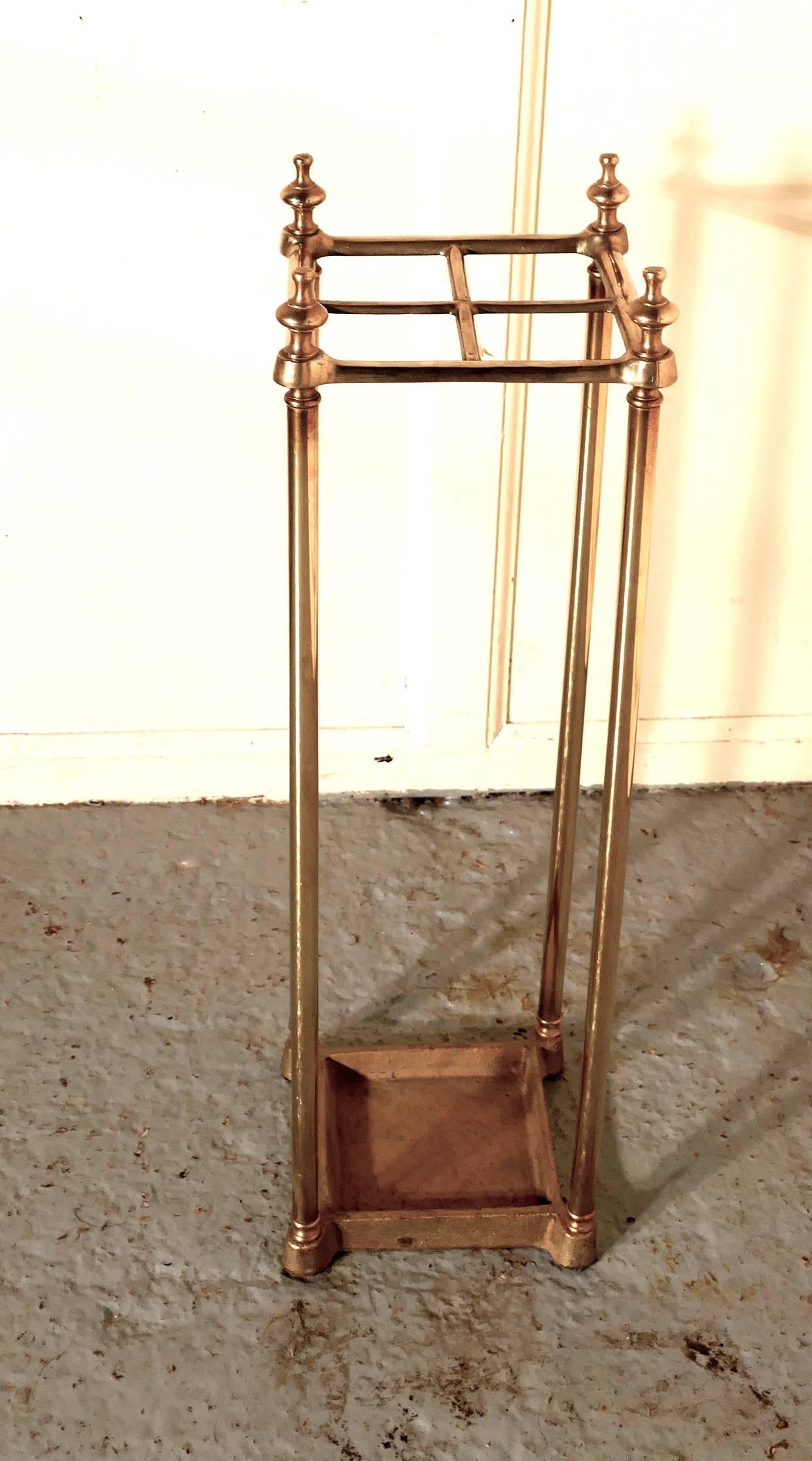 A Victorian brass and cast iron walking stick stand or umbrella stand

A charming piece, the stand has a brass top divided into four sections to hold either walking sticks or umbrellas, the heavy iron base which is painted in gold is also the drip