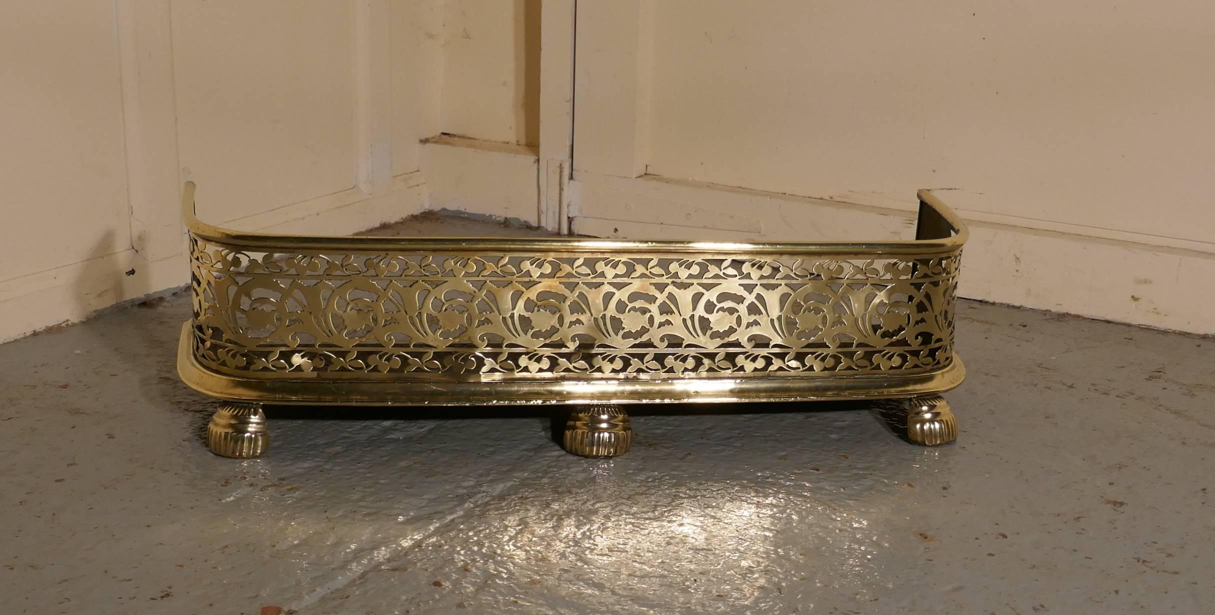 Fine quality Victorian Arts & Crafts pierced brass fender

This is a Victorian pierced brass fender it has, an elaborate pierced decoration, an iron base and stands on large hoof feet
the fender is in very good condition it is 8” high, and 31”