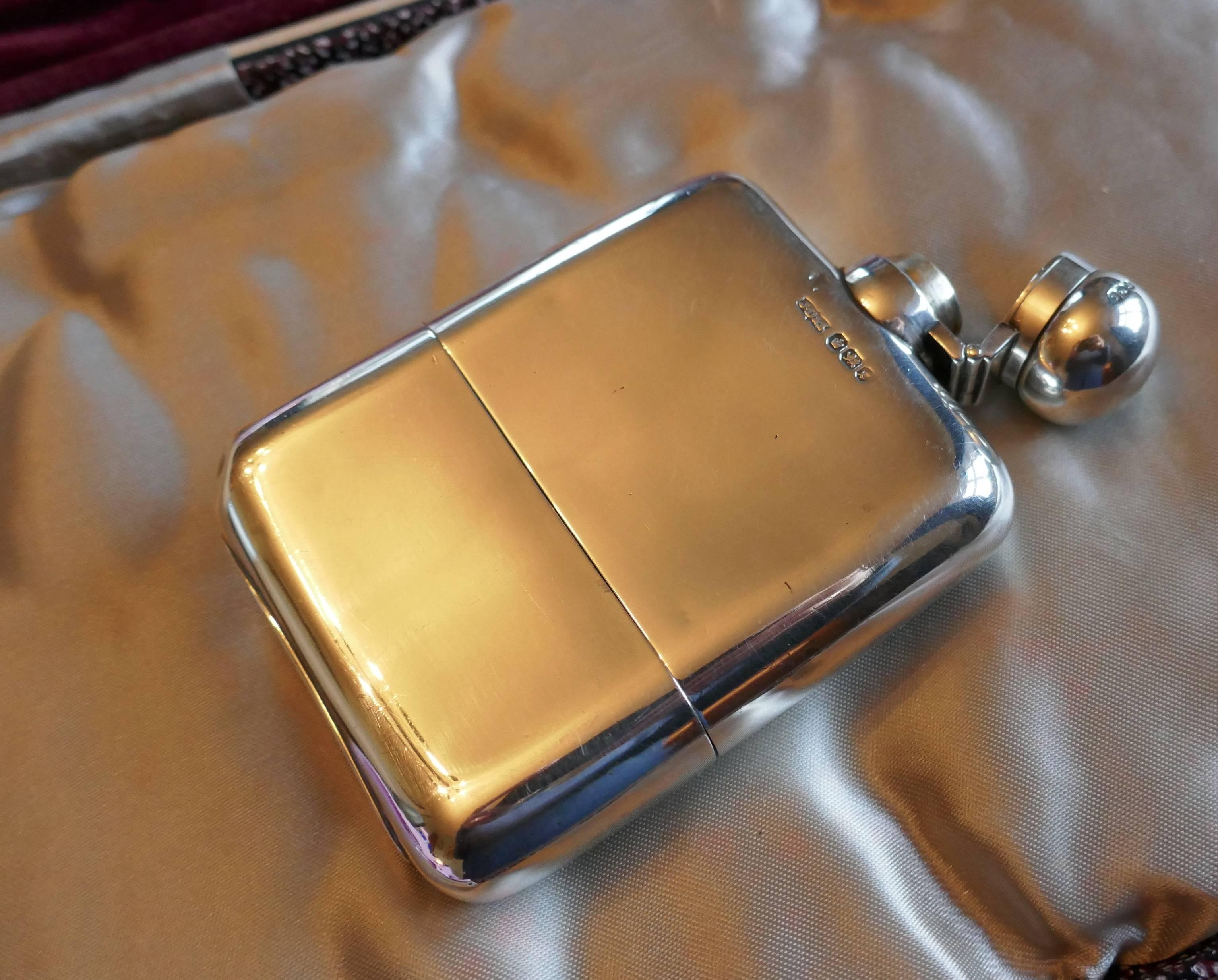 A solid silver hallmarked hip flask and cup by J Dixon, Sheffield, 1909

A lovely rounded piece the body of the flask has a slight curve, the lid is hinged with a screw grip and fits well, and the detachable cup slots on and off nicely. The flask
