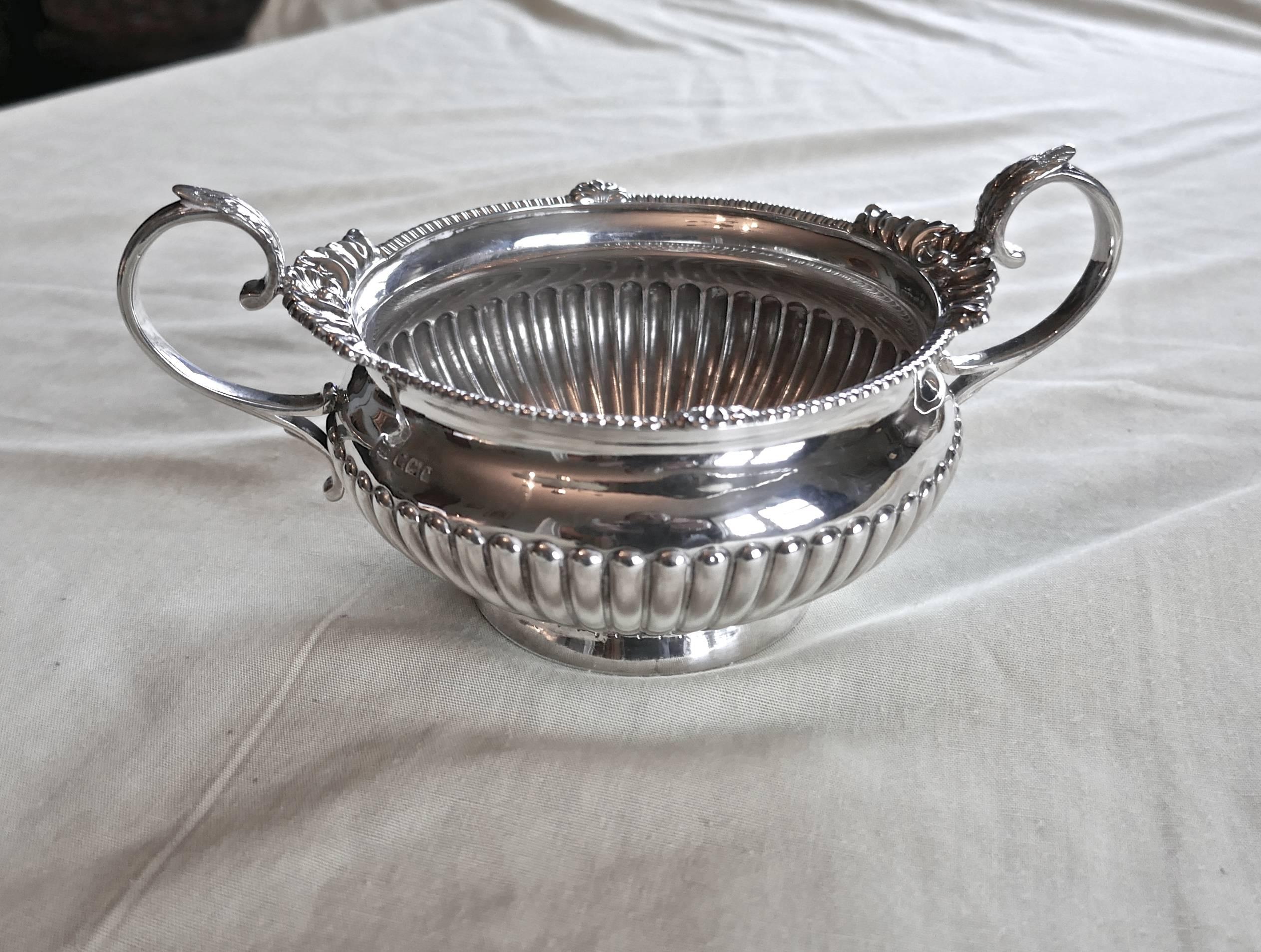This is a superb quality hallmarked silver three-piece tea set by Walker & Hall, Sheffield, 1894
Each of the three pieces, teapot, jug and sugar bowl has a semi reeded lower half on plain rim base, the upper parts have a leaf capped scroll handle,