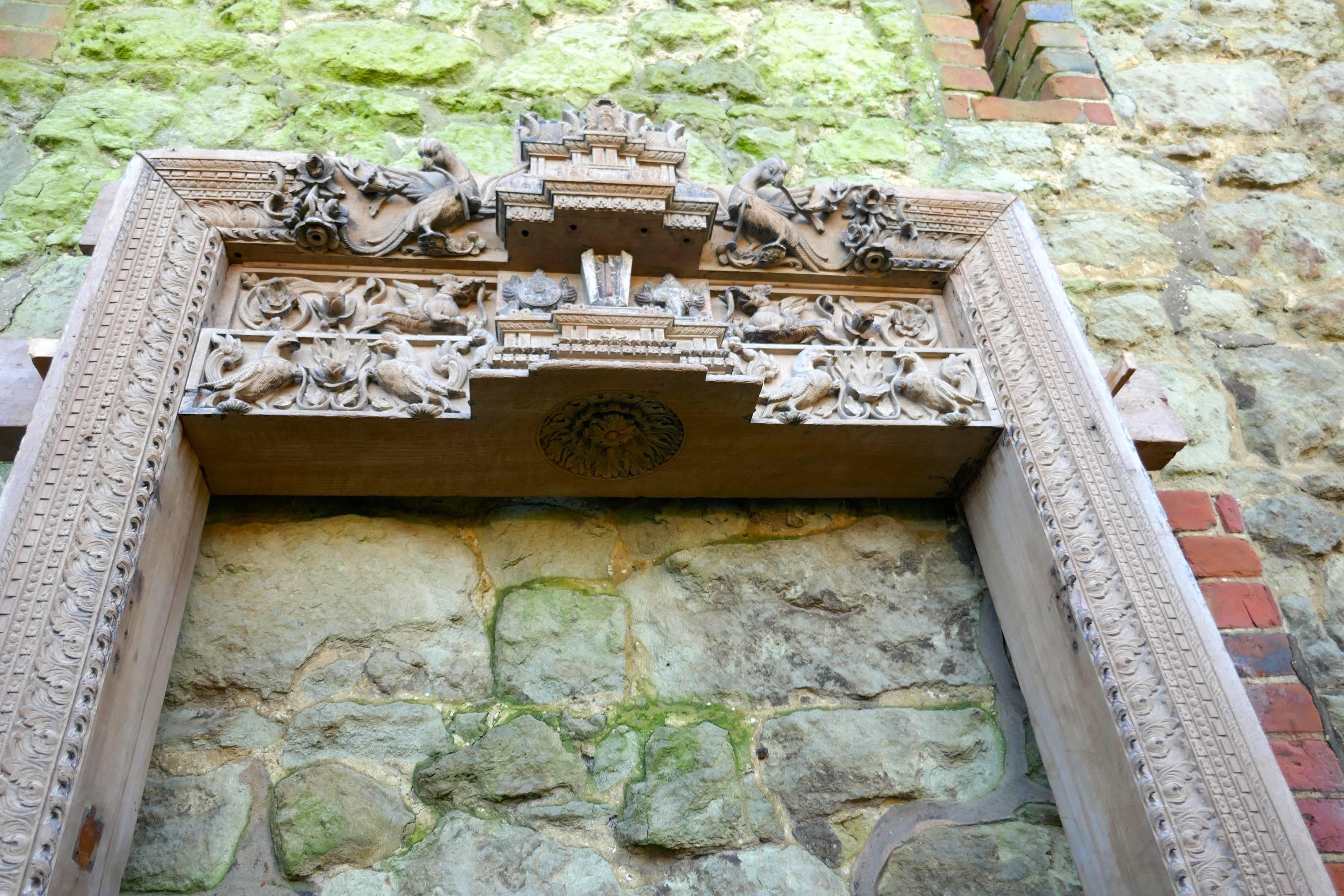 Early 19th century carved teak archway, Hindu and Buddhist temple doorway

This piece has been removed intact and with very little damage to the carvings, it is made in Teak and is profusely and intricately carved with many wonderful symbols,