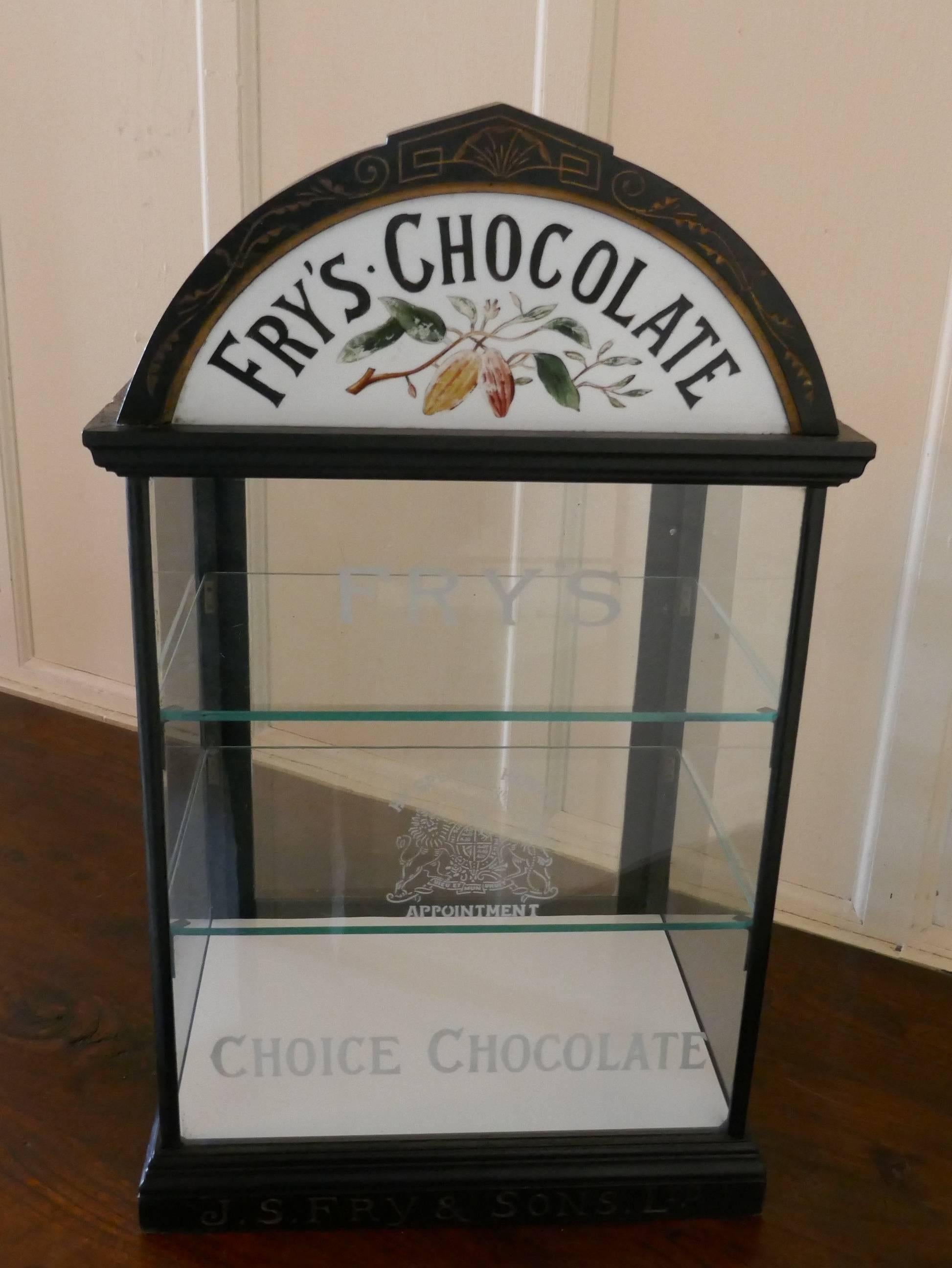 Fry’s chocolate sweet shop display cabinet

This glazed advertising Shop Display Cabinet it has an ebonised finish, the cabinet has a rather grand arching cornice. The cornice is inset with a half moon etched glass painted and decorated with FRY’S