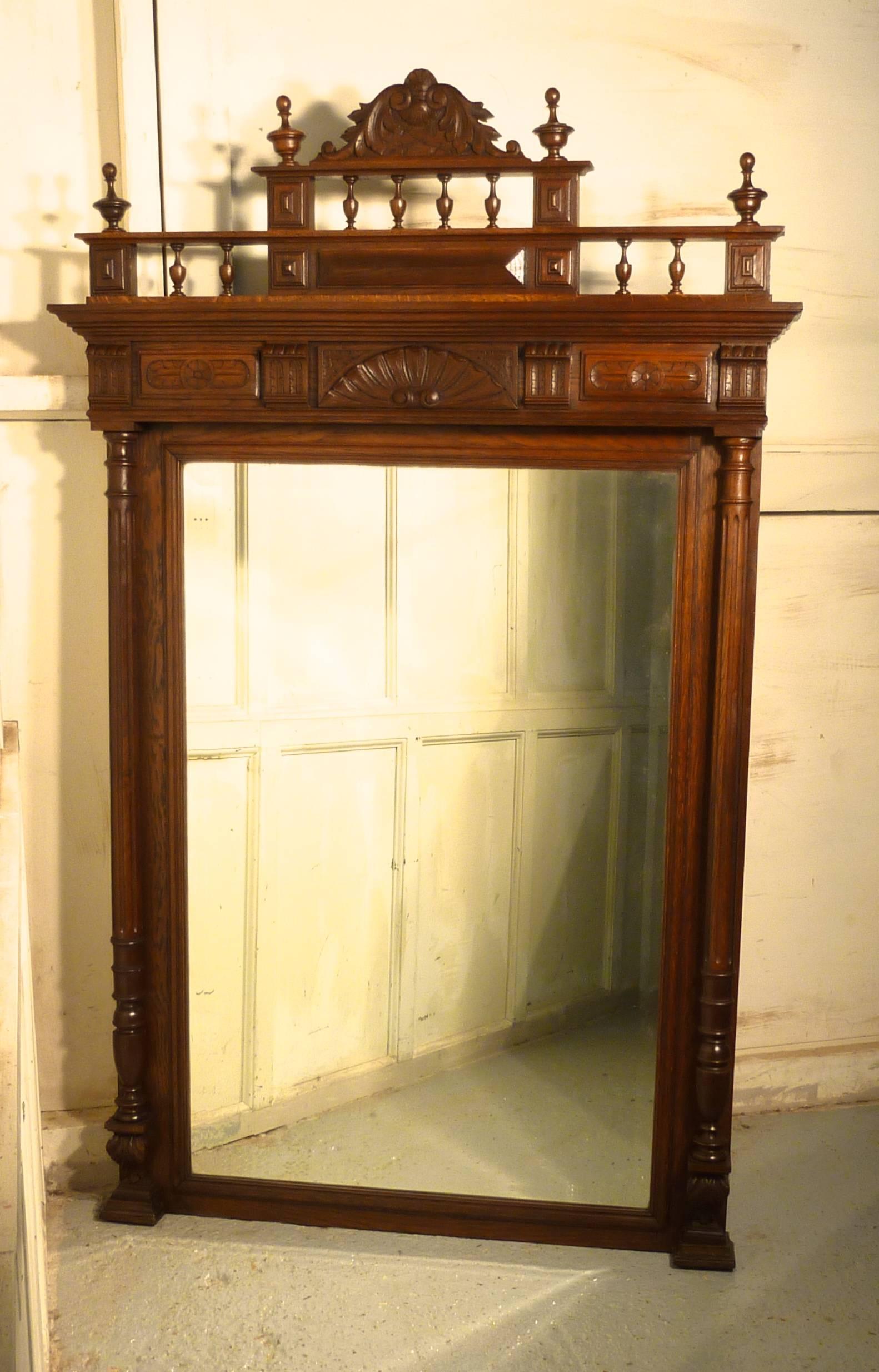 Large French Carved Oak Wall Mirror

The Fine Oak Mirror Frame is Crisply Carved with turned and fluted columns at each side and attractive mouldings, it has a large Cornice at the top with turned spindles and a shell decoration
This is a lovely