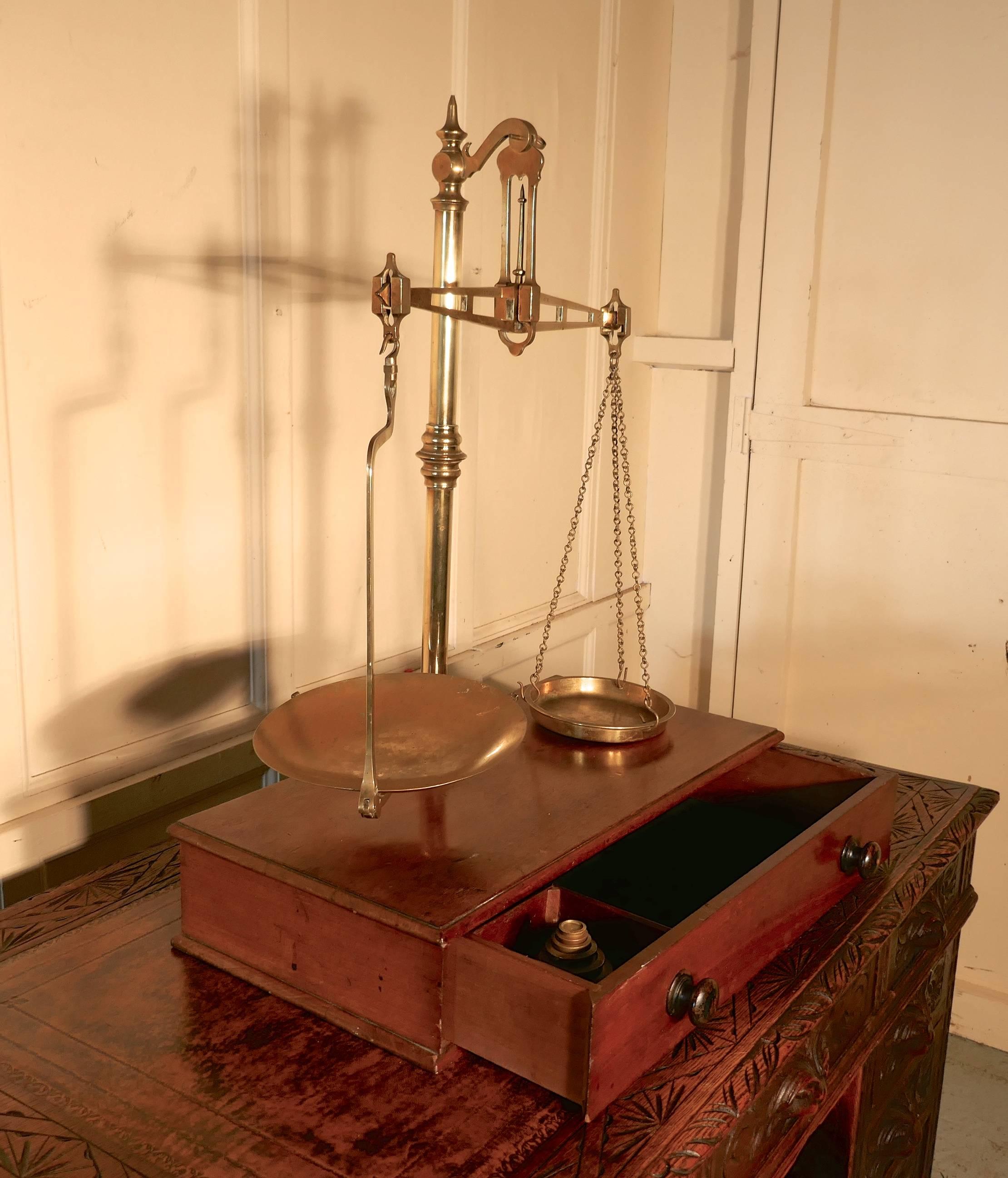 Superb set of Brass Sweetie Balance Scales by Avery

This attractive Brass balance scale on a mahogany box base has a drawer, it has a beam mechanism and was probably used in a shop although the scales can be completely dismantled and packed away in