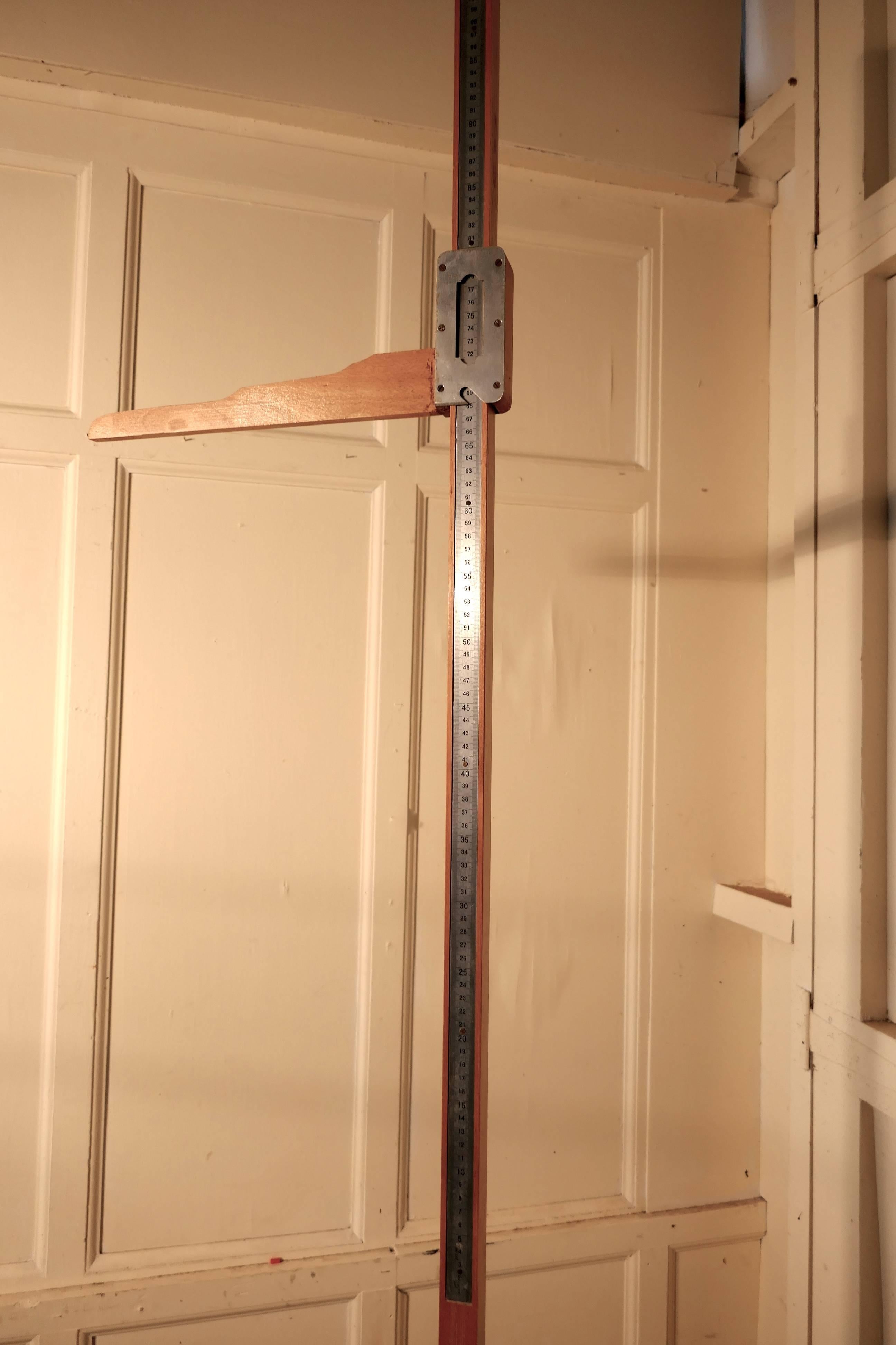 Pharmacy Height Measure Stand, Pitch Pine Measuring Stick or Somastometre

Once these along with scales were common place in Doctors Surgeries, Chemist Shops and Drug stores, the patient stood on the square base and the level was lowered on the