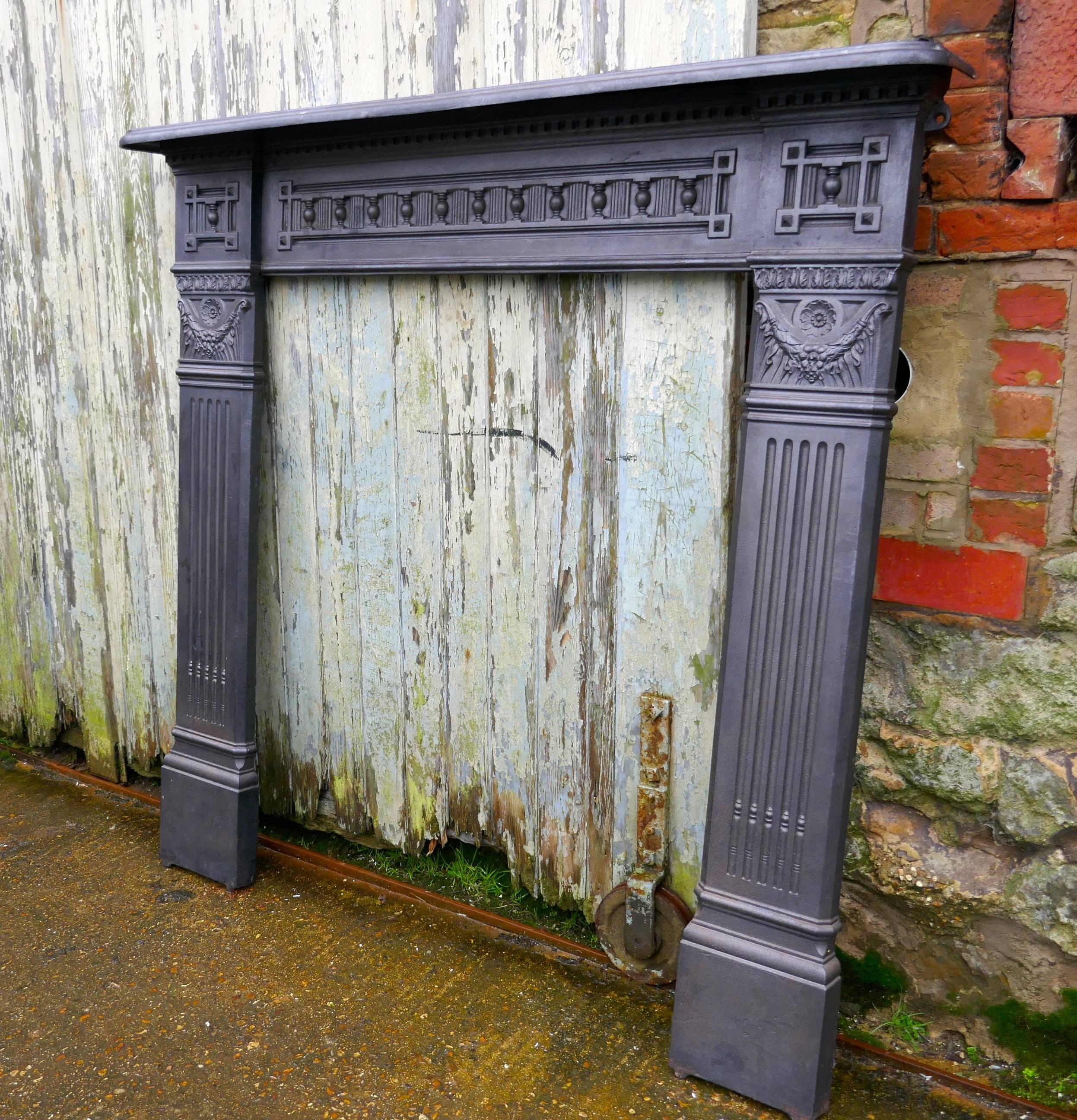 Large 19th Century Cast Iron Fire Place

This 19th Century FirePlace was rescued from a Victorian House during extensive renovations

The Fireplace is Cast Iron, the side supports are fluted and it is decorated beneath the mantlepiece
The Fire place