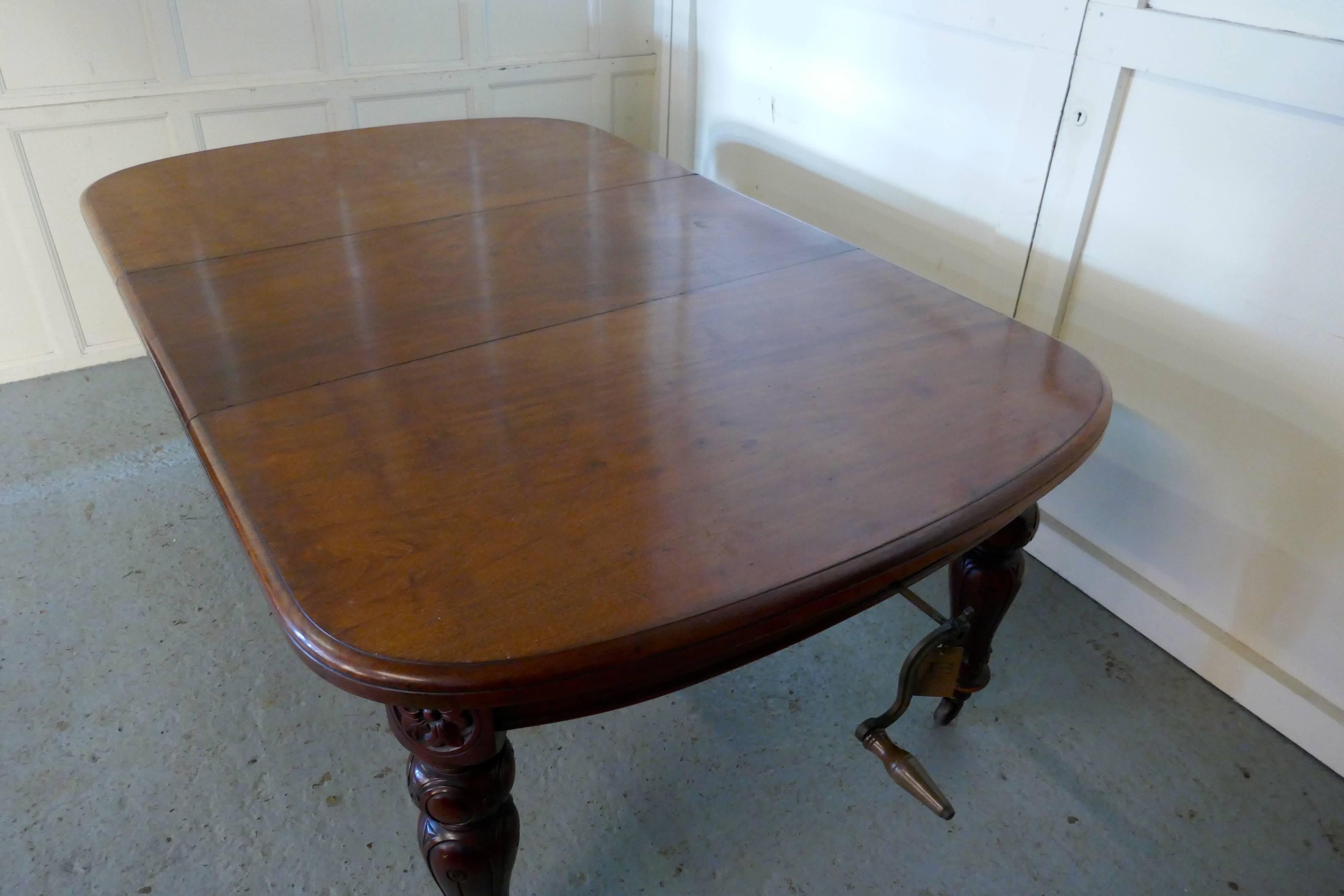 Early Victorian mahogany extending dining table, seats 12 diners

This is a lovely table, it dates from the very early part of the 19th century, the table opens in the centre, by means of a winding mechanism this allows the addition of a solid