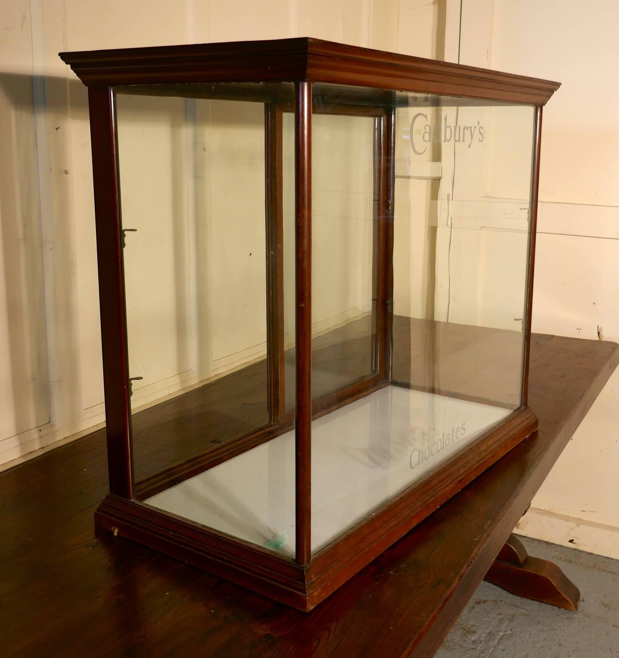  Cadbury’s counter top sweet shop display cabinet 

This glazed shop display cabinet is made mahogany, the glass has etched lettering on the front of the cabinets saying Cadbury’s at the top and chocolates at the bottom 

The cabinet has two sliding