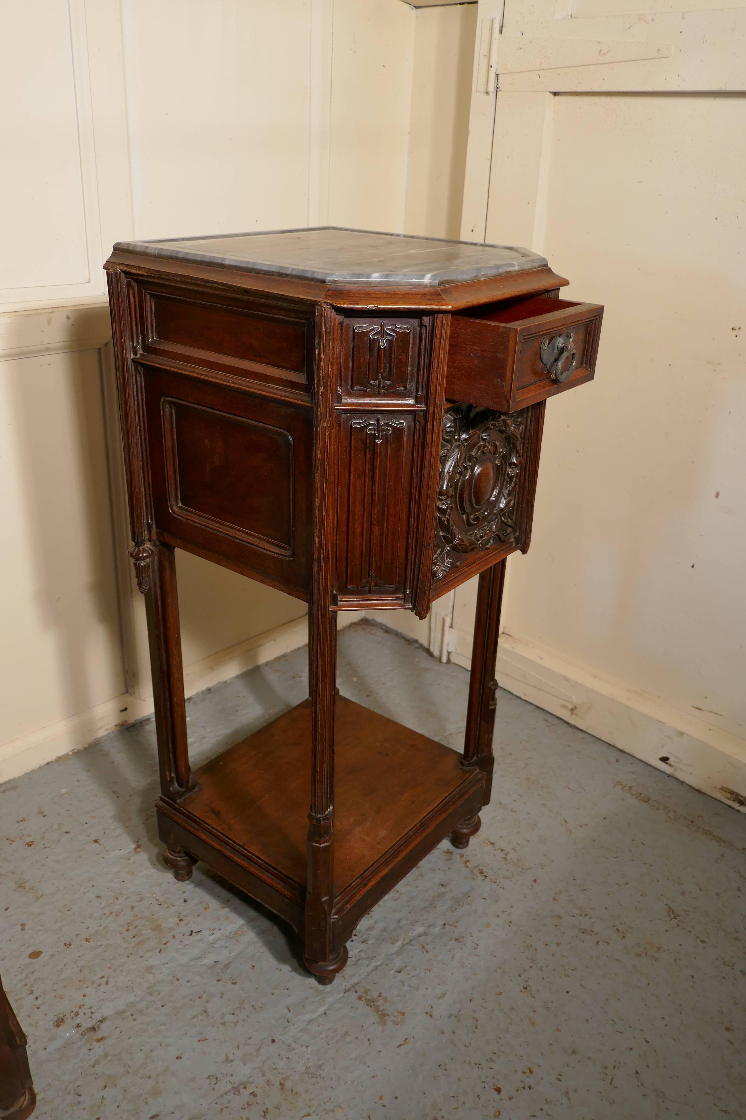 Pair of French 19th century Gothic oak bedside cupboards 

This is a rare pair of 19th century Gothic oak bedside cabinets, the grey marble tops have a shaped edge to the front, and there is a small drawer in the front and a marble lined cupboard