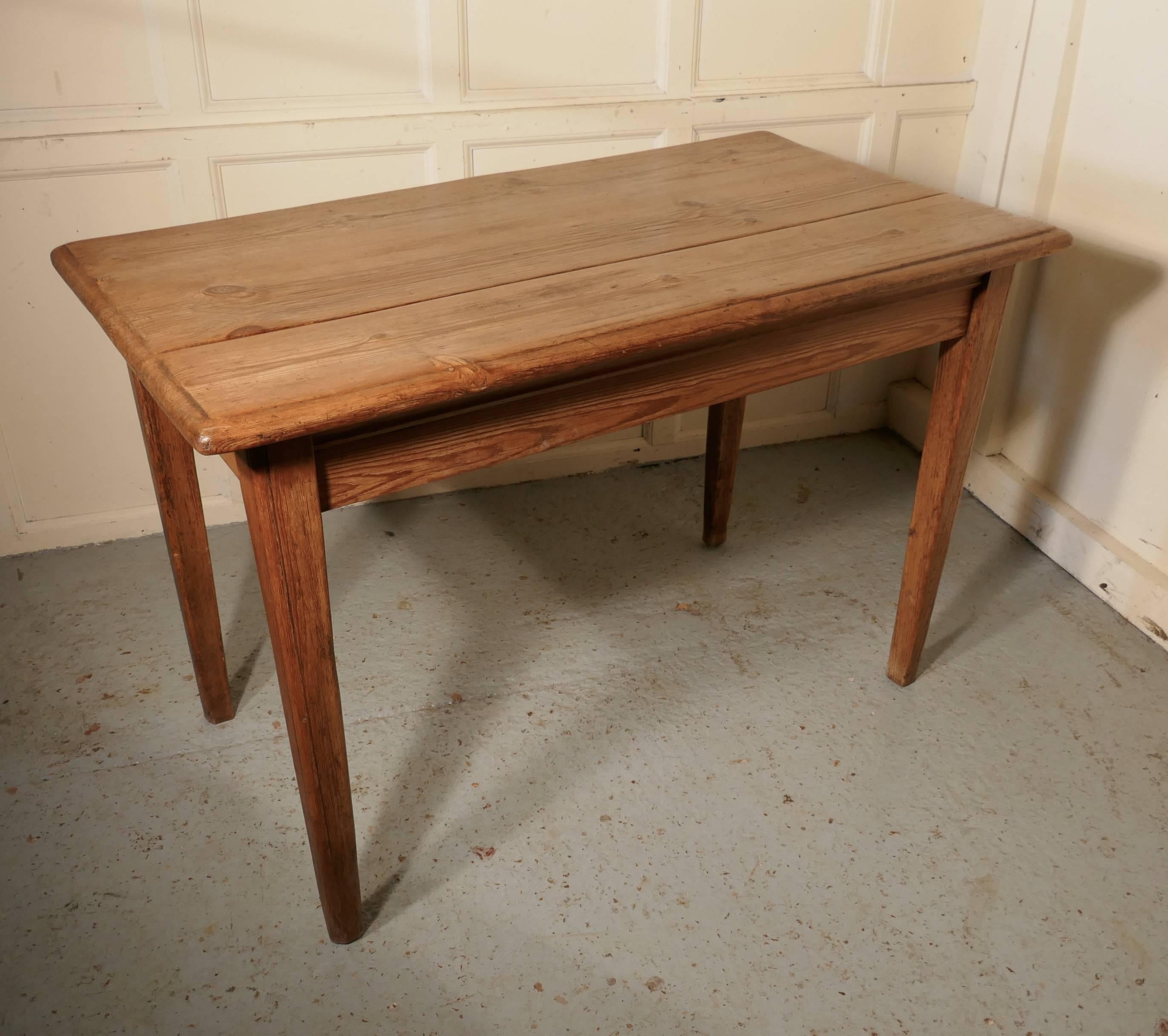 Victorian planked top farmhouse kitchen pine table

This is the one we are all fond of, an old Victorian planked top farmhouse kitchen table
The table is made in pine it has sturdy square slightly tapering pine legs and a 1” thick pine plank top
