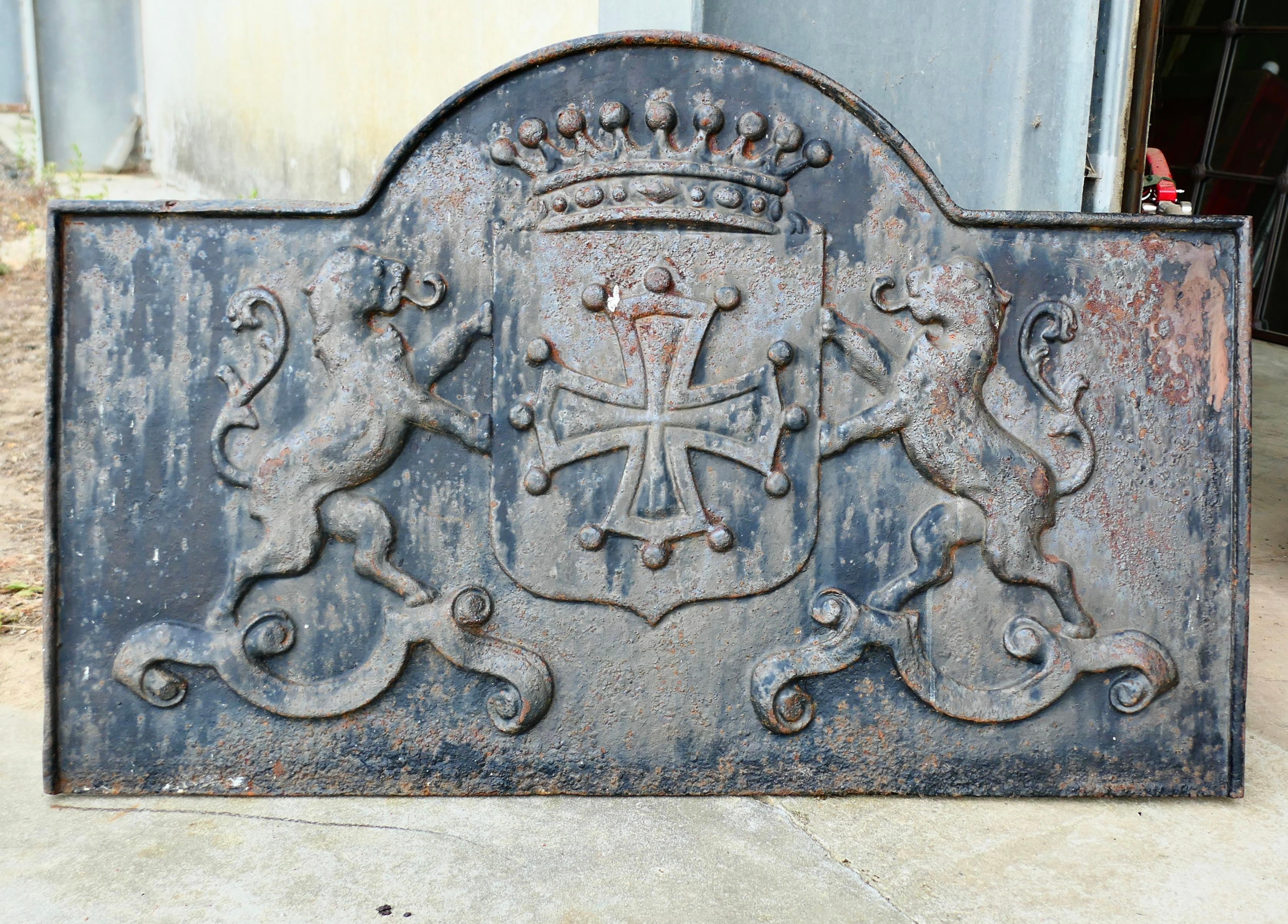 Arch Top Fire Back, Crown, Shield, Cross and Lions

The fire back has a large shield in the centre this has a Celtic Cross and a crown over the top with a rampant Lion on either side The fire back has a shaped top and a raised border around the
