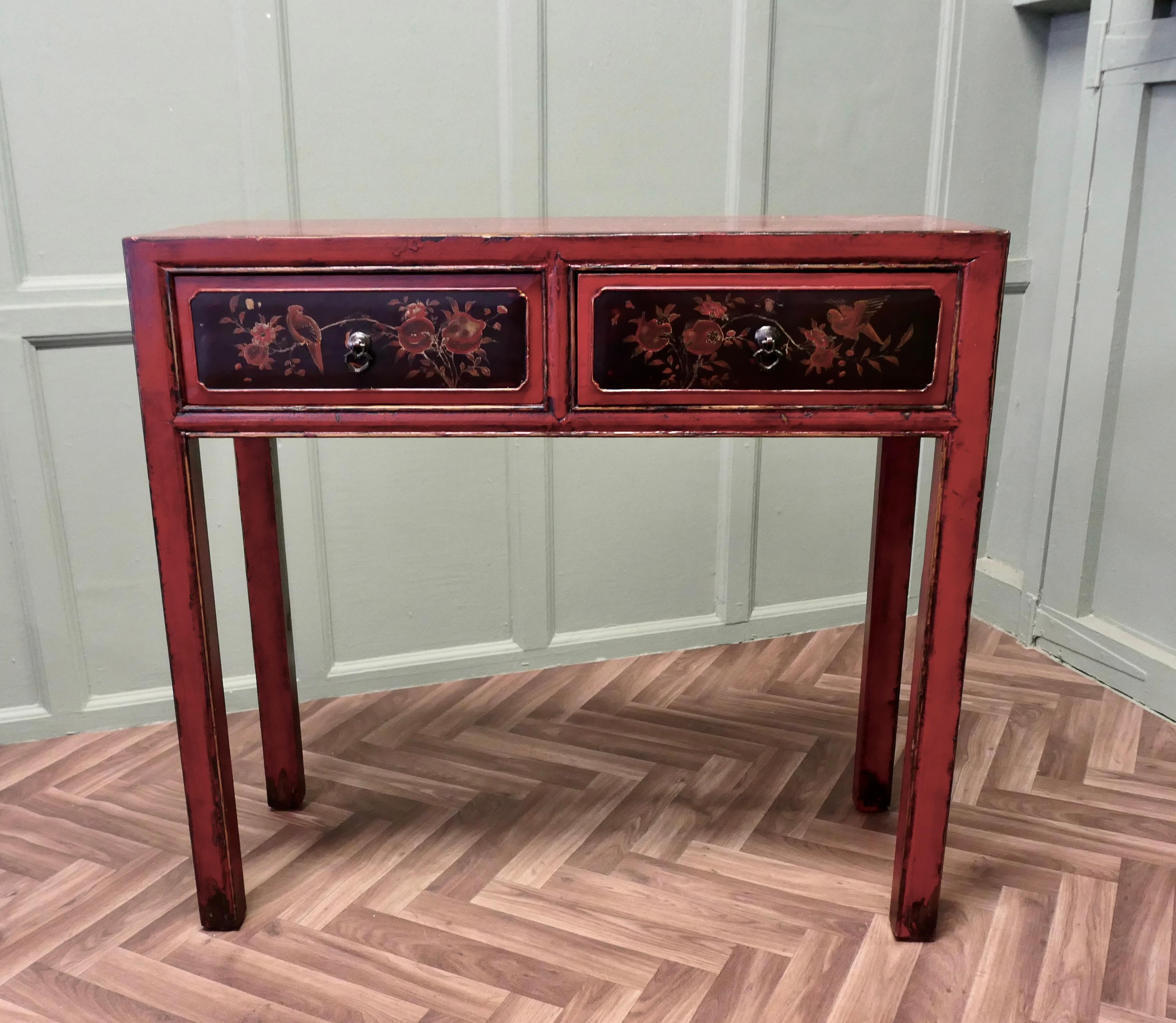 Oriental Red Lacquered Side Table or Reception Table

This is a very attractive piece, the table has a red lacquer finish which has a delicately worn patina where it has been lovingly polished for many years. The table has 2 drawers with bird and