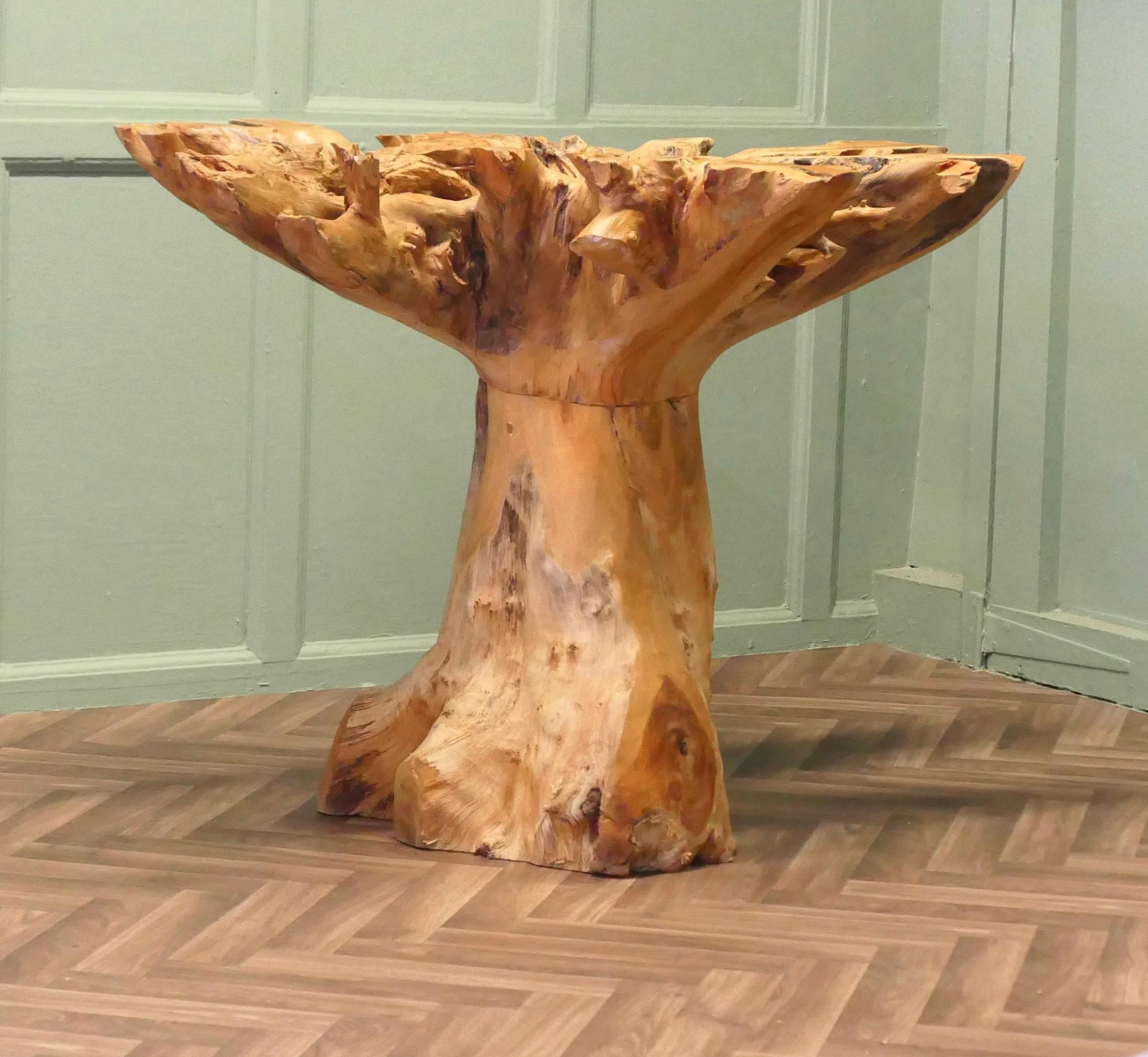 Yewwood Root Tree Dining Table With Round Glass Top  

A Fantastic and Unique piece.
The root wood has stunning beauty and what a wonderful piece touring into your home or garden.
The table is in good used condition and can seat up to 6 as it is 51”