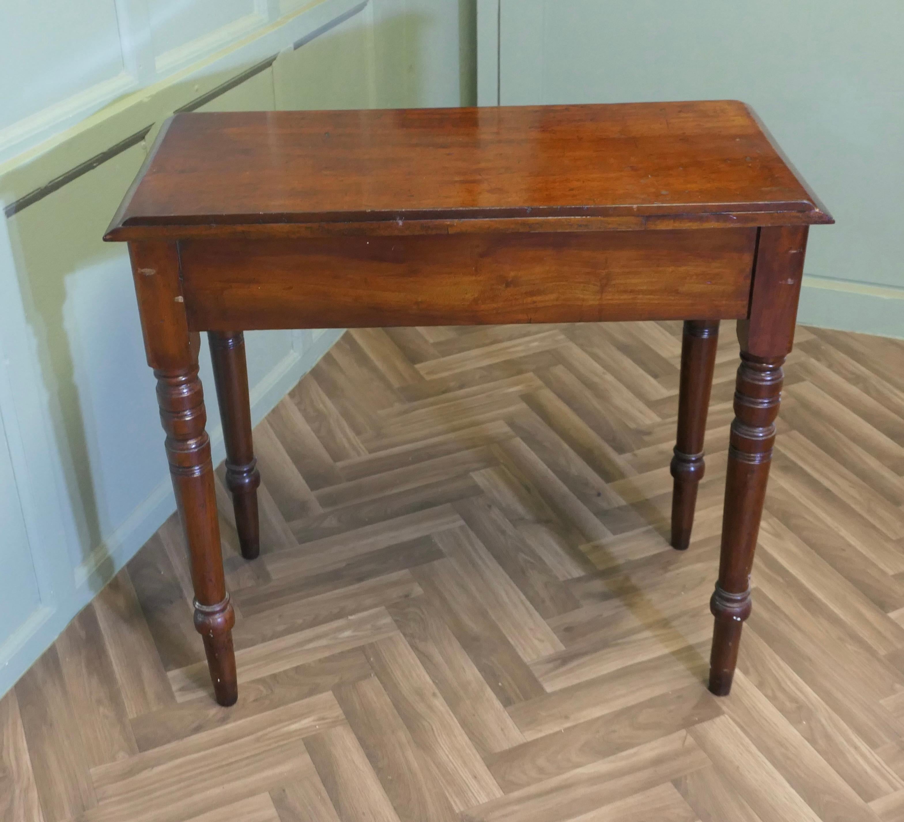 A Small Victorian Mahogany Hall Table or Reception Table
The Table has a small drawer on the front and a low gallery at the back. The table stands on crisply turned mahogany legs, and has a bright finish.
The table is in good sound condition and