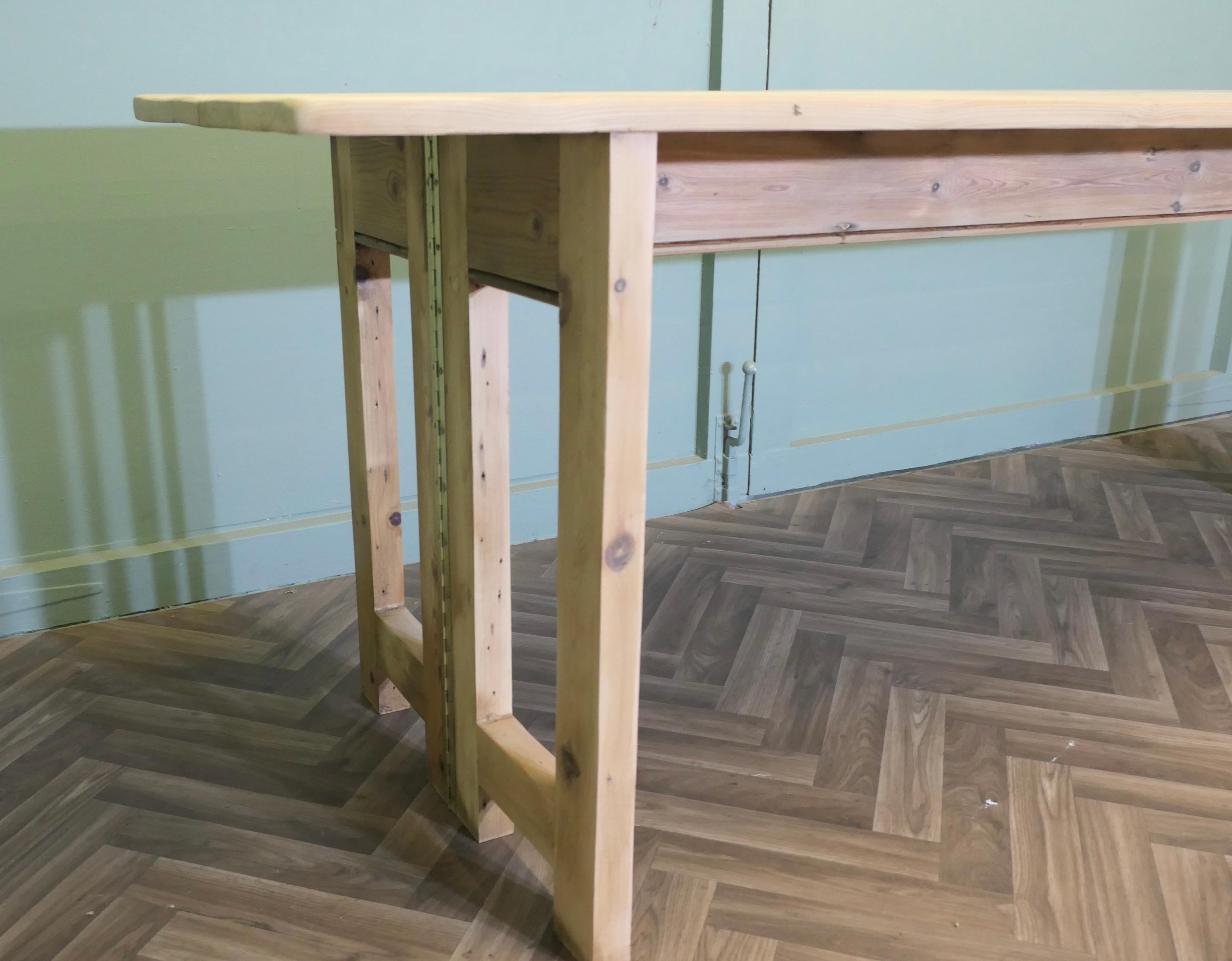 A Very Long Extending Pine Dining Table For Sale 1