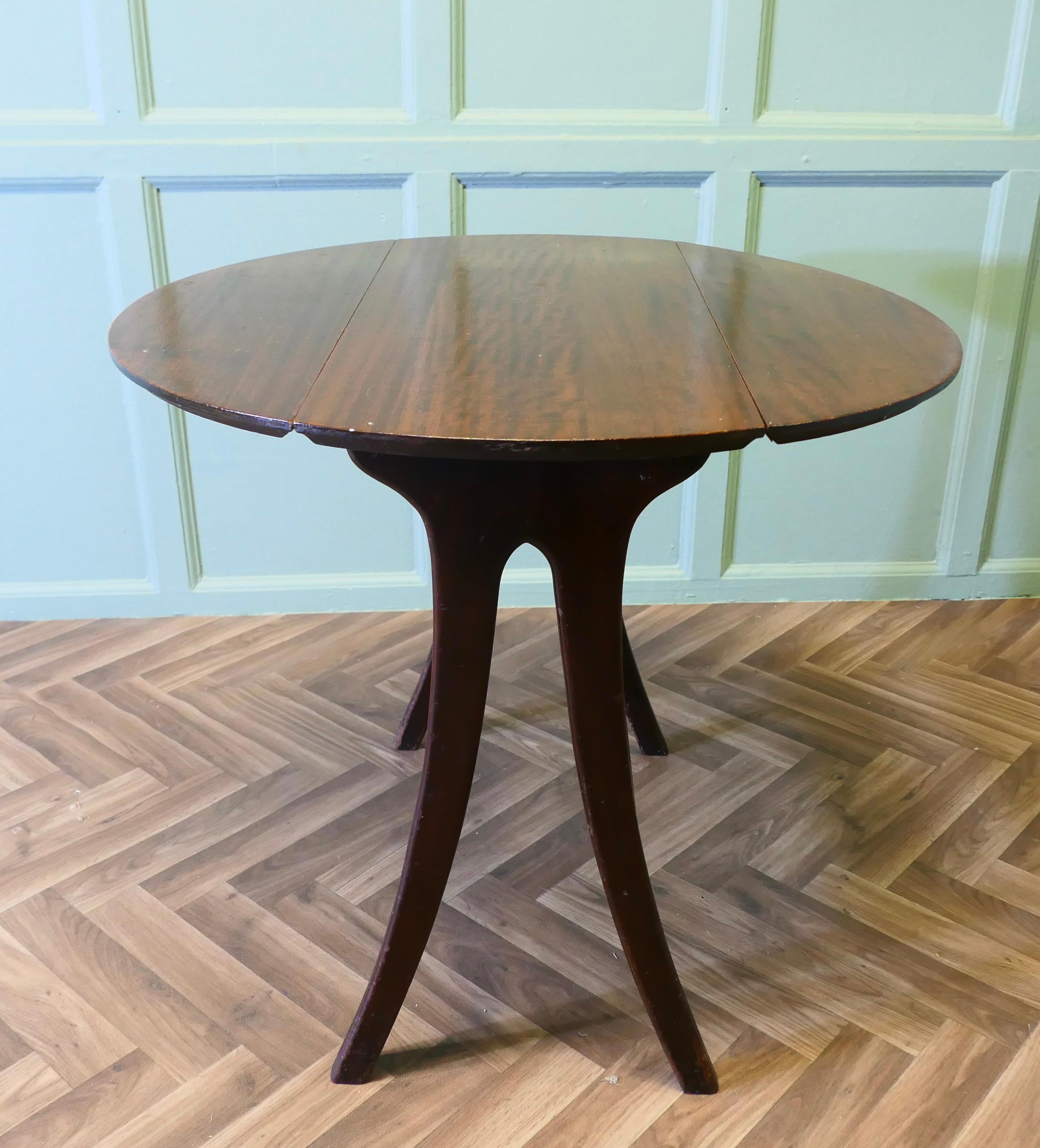 Very Retro Stylish 1950s Snap Top Dining Table for 2
The table stands on splays legs it is very sturdy and stylish and when the leaves are closed down it takes up very little space, when both leaves are lifted it is a round table large enough for 2