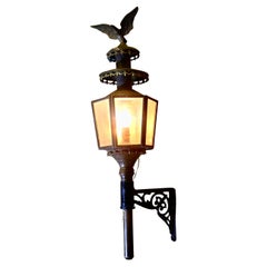 A Large Brass Carriage Light with Eagle, Wall light