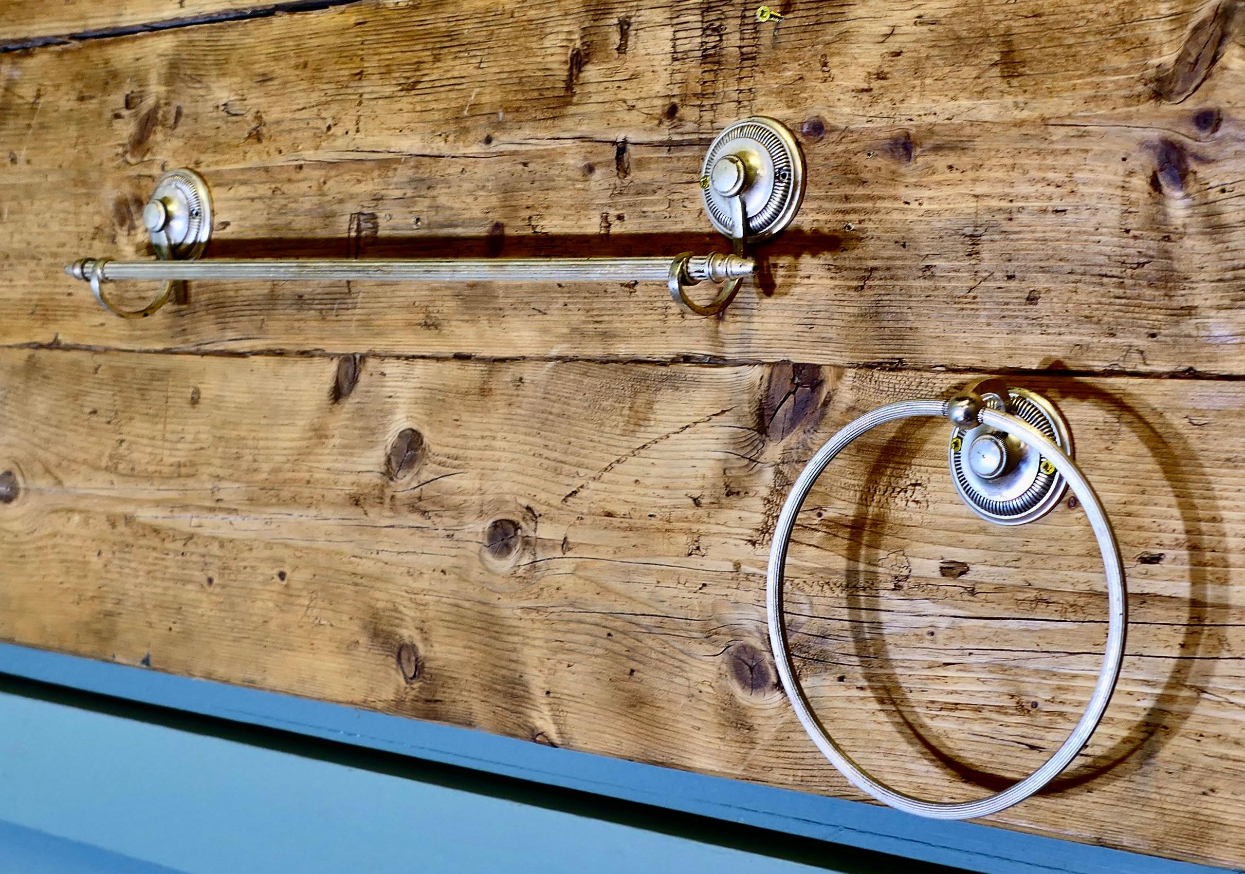 Silver Plated Towel Rail and Towel Ring
An unusual set being silver ideal fro drying towels in a small cloak room, the rail is 22” long, the ring is 7” in diameter
HW132

