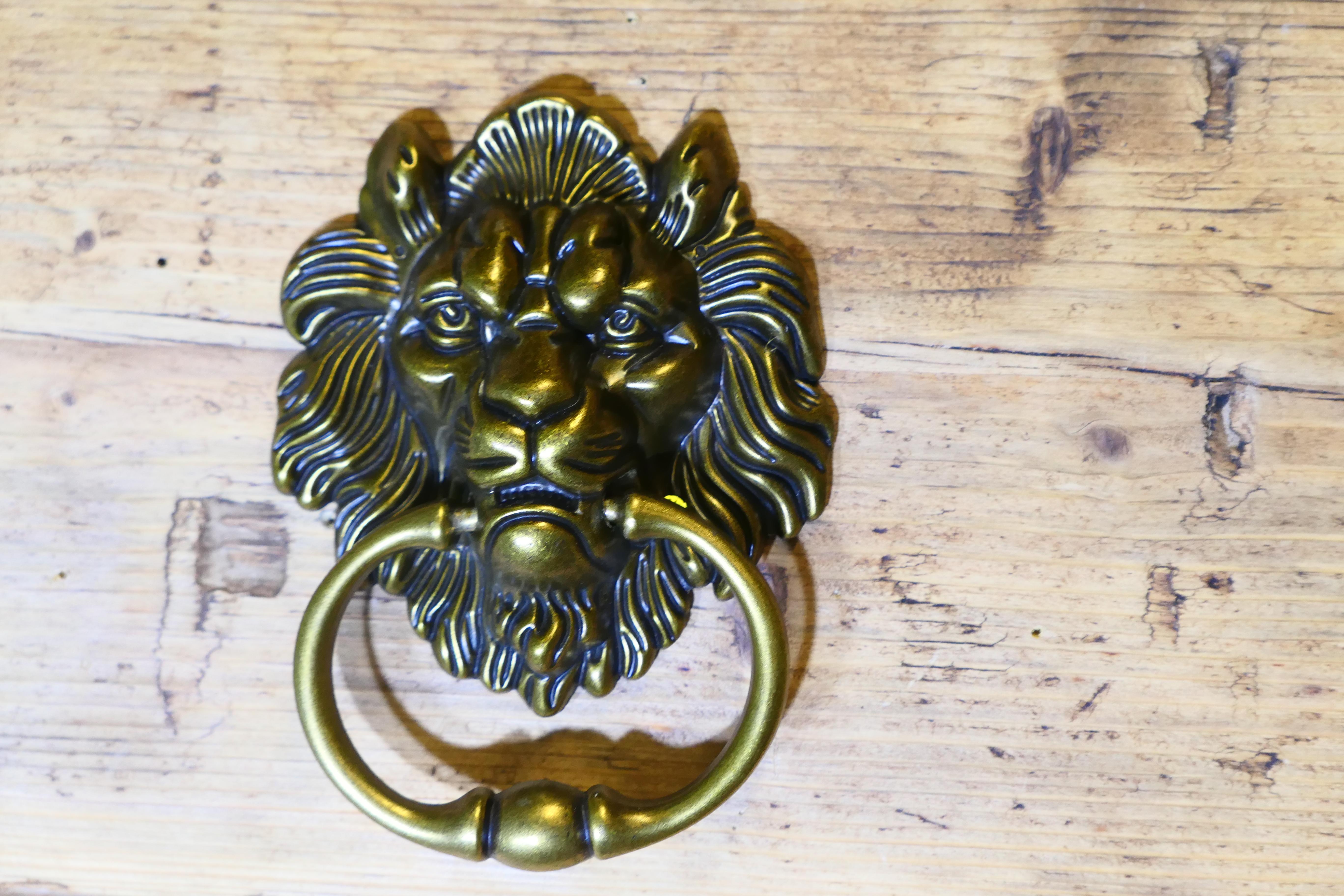 Gothic Lion’s Mask Brass Door Knocker 

This is a good looking door knocker, the handsome Lion’s Head is at the centre and the outer ring strikes the sound
The door knocker is in good condition it measures 6” in diameter 
HW133