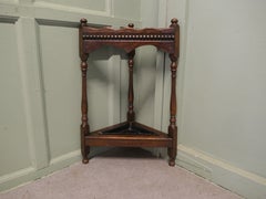 A Turned Oak Corner Stick and Umbrella Stand This is a very unusual piece