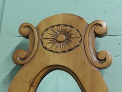 A Trio of Oval Satin Walnut Wall Mirrors
