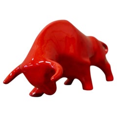 A Bright Red Cubist Sculpture Charging Bull
