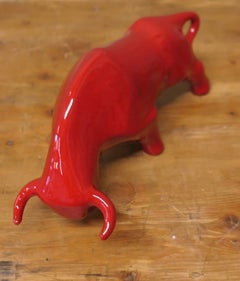 A Bright Red Cubist Sculpture Charging Bull