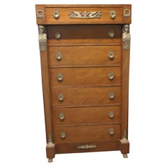 A Tall French Empire Walnut Chest of Drawers in the Neo Classical Style