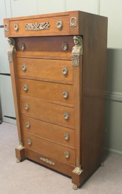 A Tall French Empire Walnut Chest of Drawers in the Neo Classical Style