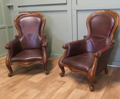 A Pair of Victorian Leather Spoon Back Easy Chairs.