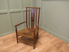 A Liberty Morris & Co Rush Seated Low Armchair