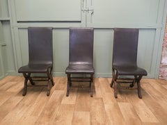 A Set of 3 Mid Century Leather and Oak Fireside Sling Chairs by Pierre Lottier