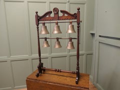A 19th Century Walnut Rack of 6 Tuned Musical Brass Bells This is a rare piece