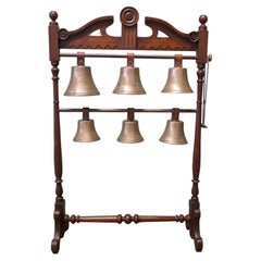 A 19th Century Walnut Rack of 6 Tuned Musical Brass Bells This is a rare piece