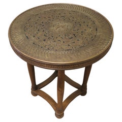 Arts and Crafts Brass Top Table, Peacock This piece is being offered from a dis