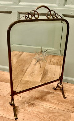 A Fine Quality Art Deco Brass and Sunburst Mirror Fire Screen This is a decorat
