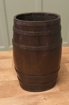 A Large Oak and Brass Barrel Stick Stand
