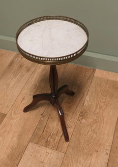 Napoleon III Marble and Brass Top Wine Table This lovely table stands on a thre