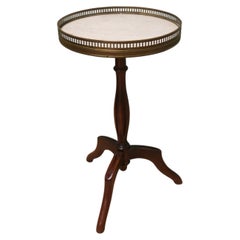 Napoleon III Marble and Brass Top Wine Table This lovely table stands on a thre