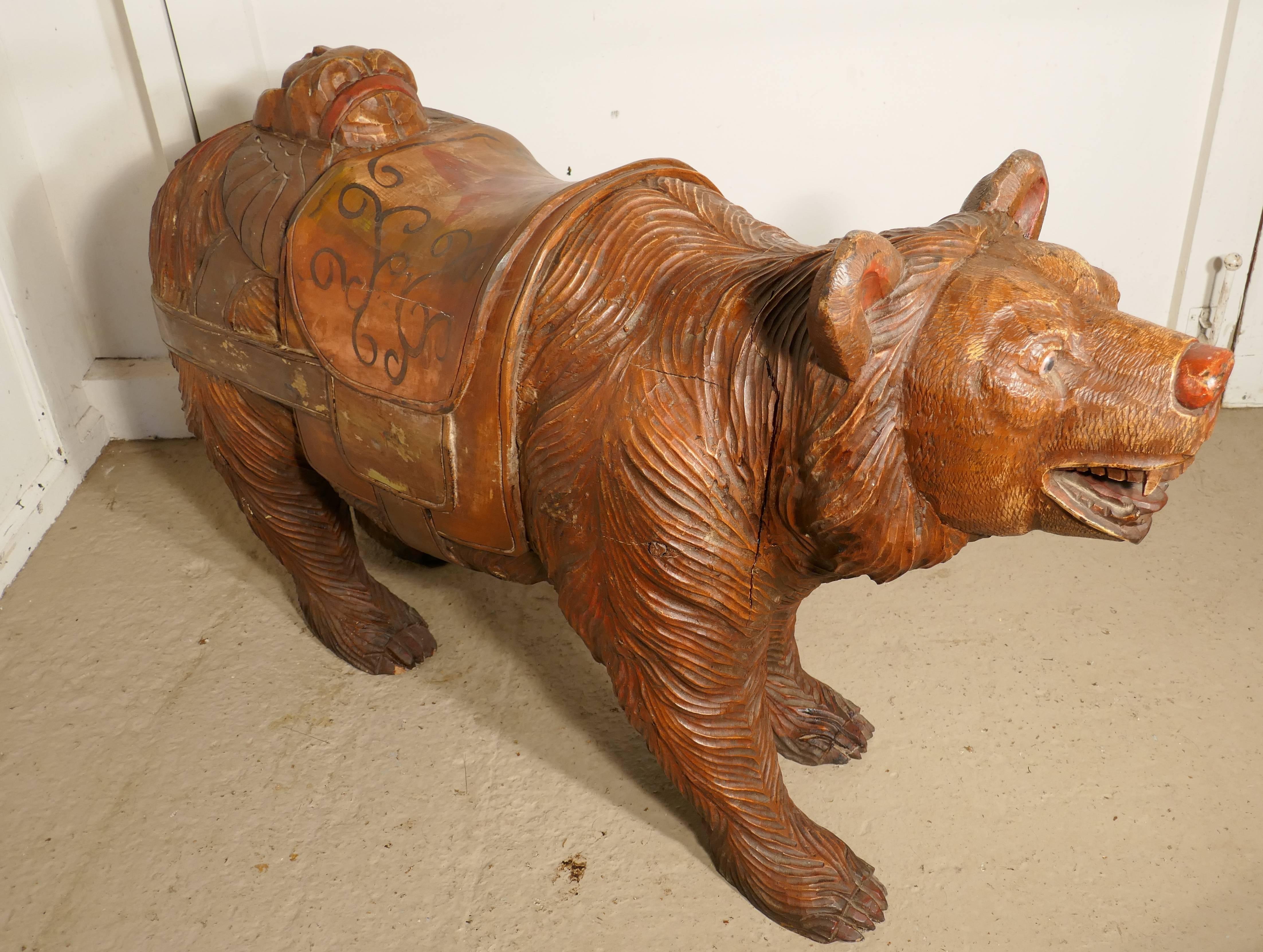 This charming if somewhat fearsome beast is a 19th century carved wooden bear he originates from the Black Forrest and has has detailed carving with Folk Art painted decoration
Our bear comes from a country merry go round or carousel, he is made
