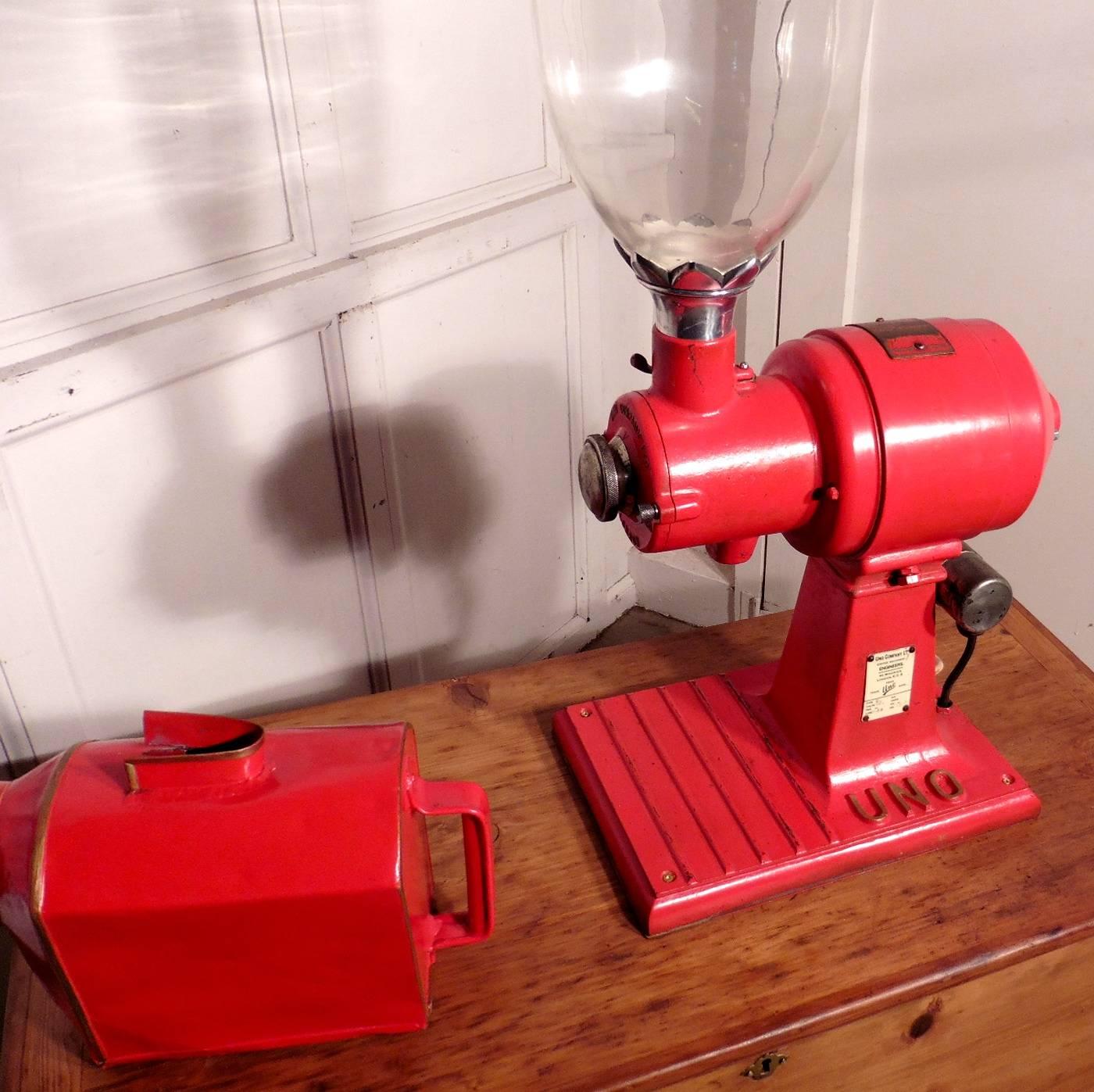 A rare piece indeed and design icon of its time made in London

This big red machine with its glass hopper would have been seen in all grocer’s shops in a bygone era.
The smell of coffee freshly ground to order, we all know that so well, the