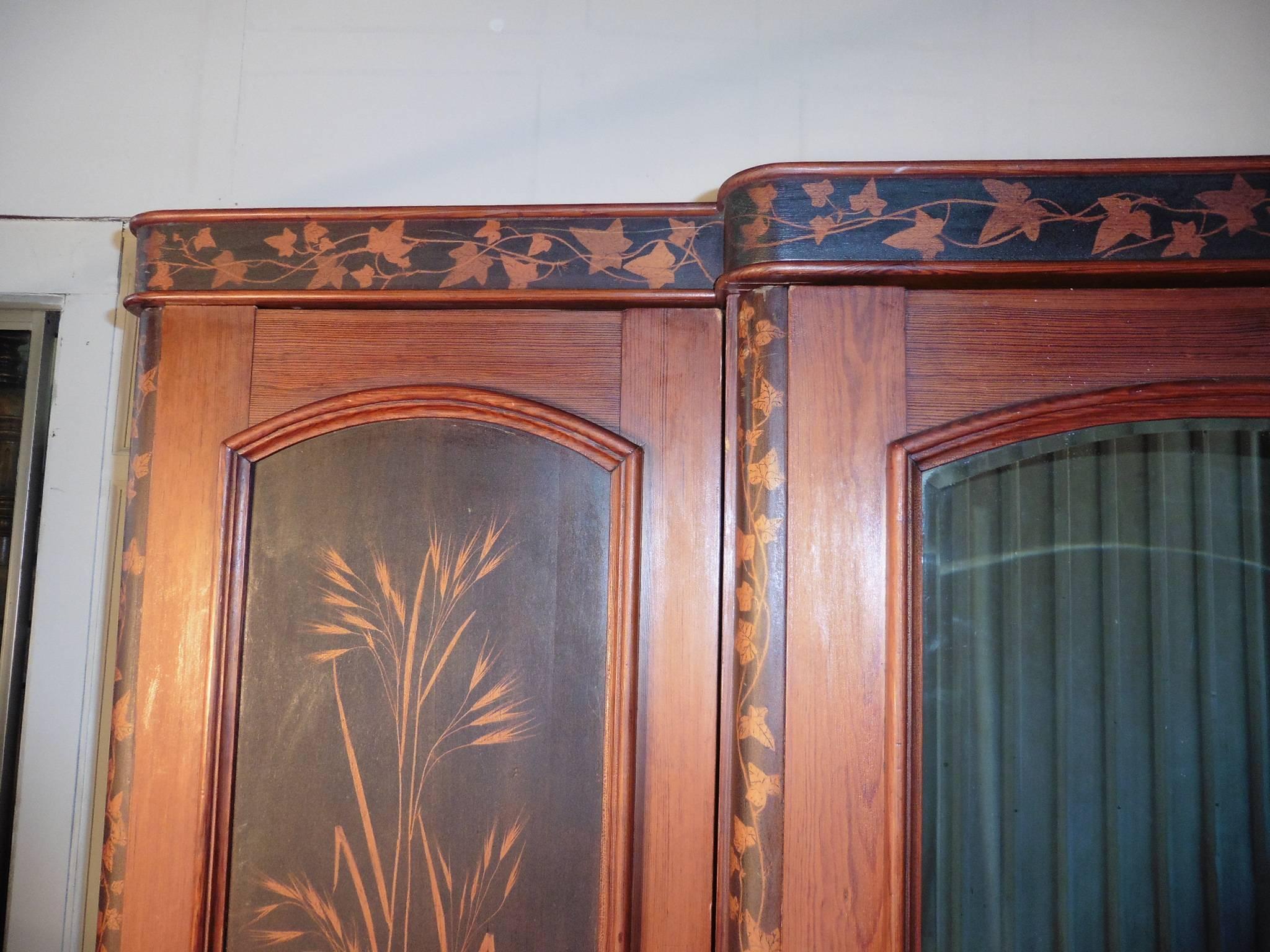 This is a very unusual piece, the wardrobe is a superb quality piece all the wood is the finest quality, it has its original painted decoration, the decoration is in black on the pine it has all manor of leaves, ferns, grasses and ivy set in large