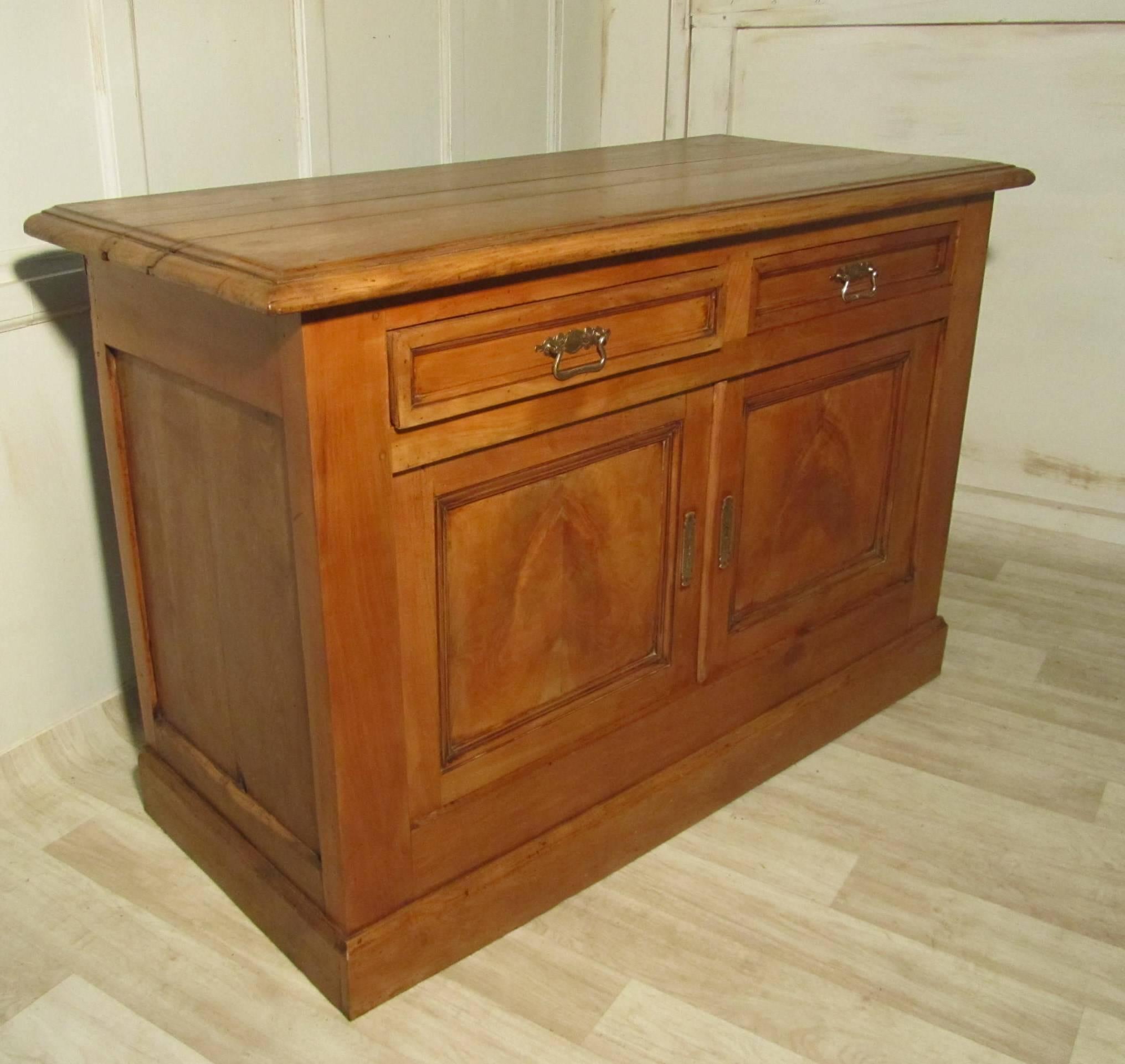 This is a splendid piece, it is well over 150 years old and has the most wonderful patina, the dresser is made in cheerywood 
The dresser is rustic heavy piece, the two doors enclose one large shelved cupboard and there are two drawers above.
The