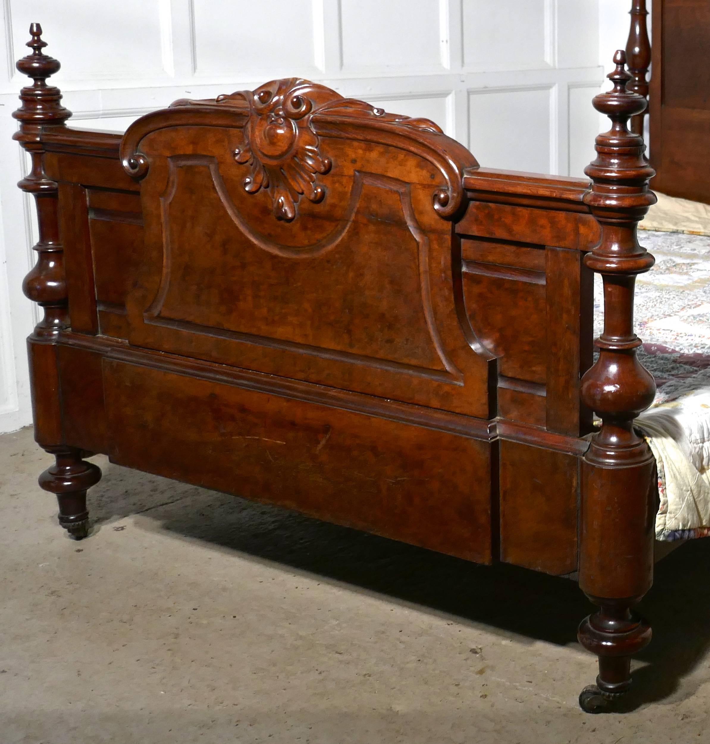 This Bed is a stunning piece with its high headboard and decorative foot end. 
The head board has a large armorial shield in the centre and on either side it has superbly turned uprights with very large carved and turned wooden finials

The foot