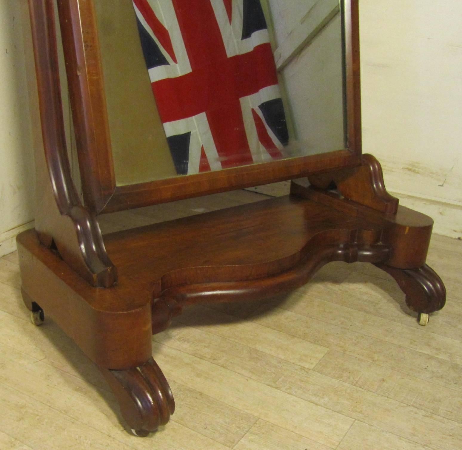 Large Victorian mahogany Cheval mirror

Large Victorian mahogany Cheval mirror this is a good quality piece the stand is in mahogany with scroll feet and curved uprights, the mirror original condition, and in pretty good condition with a few small