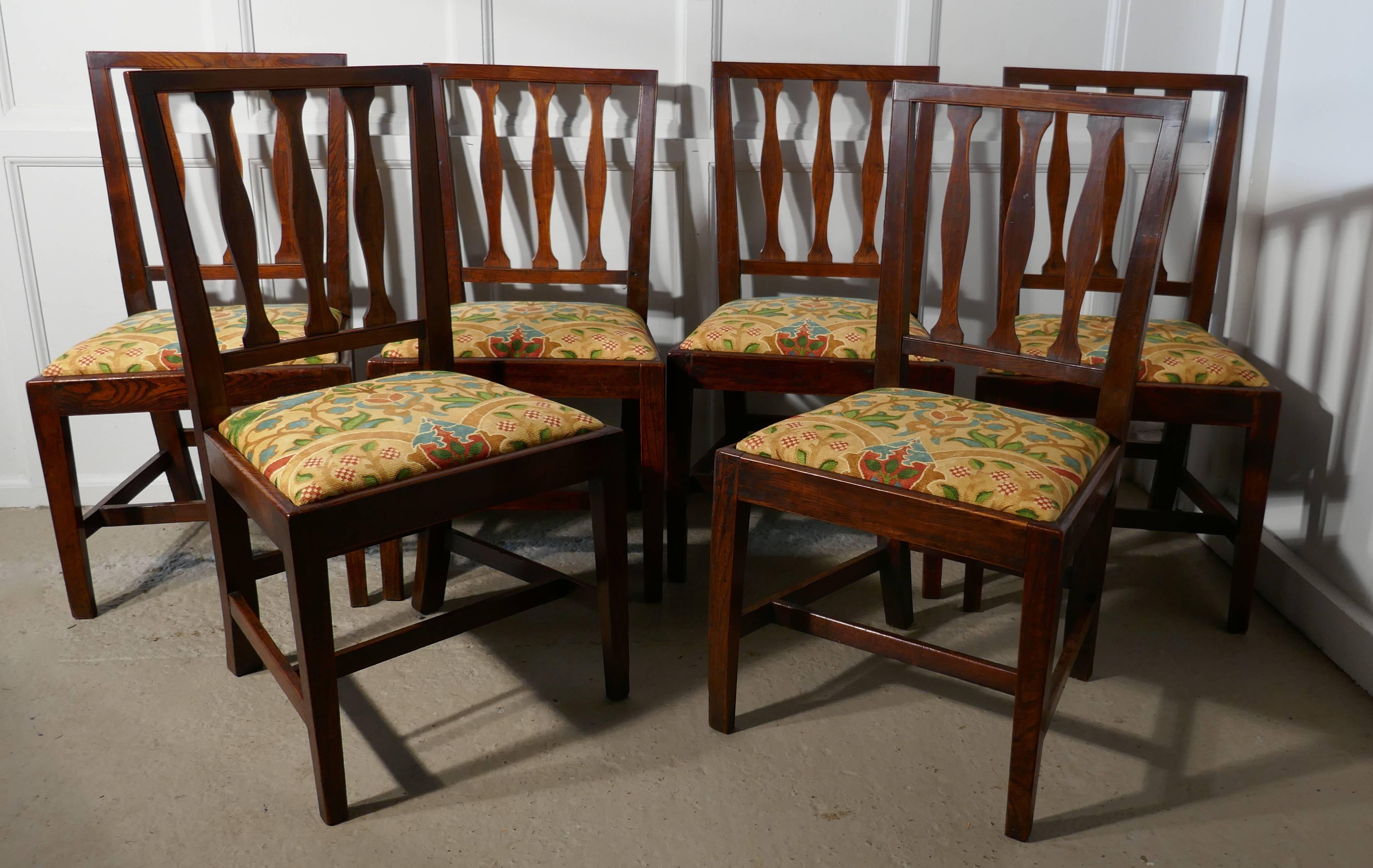 This is a very handsome set of Georgian Country chairs, the Elm frames have sturdy square legs and stretchers and the backs have shaped slats. 
The drop in seats have been recently covered, with a superb quality Liberty Art Nouveau velvet
The